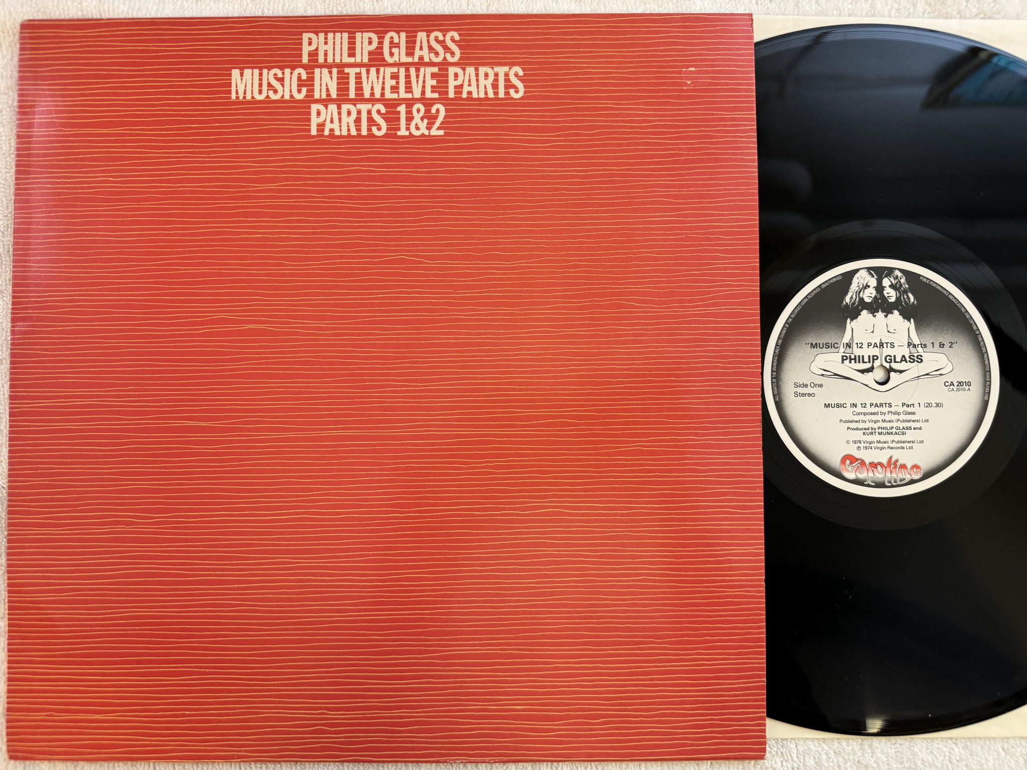 Omslagsbild för skivan PHILIP GLASS music in twelve parts 1&2 LP -76 CAROLINE CA2010