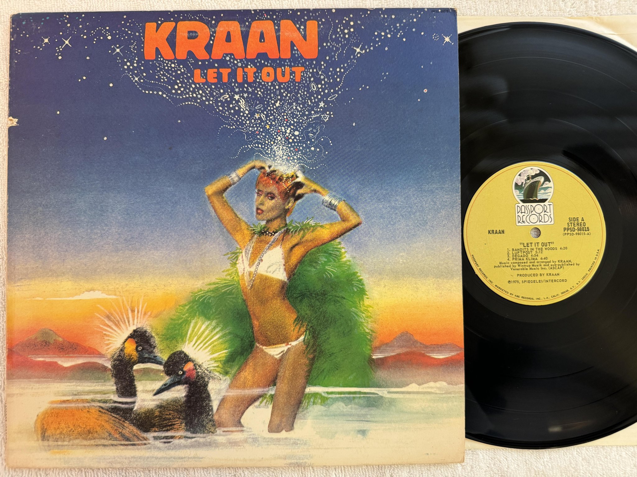 Omslagsbild för skivan KRAAN let it out LP -75 US PASSPORT PPSD 98015 *** KRAUT ***