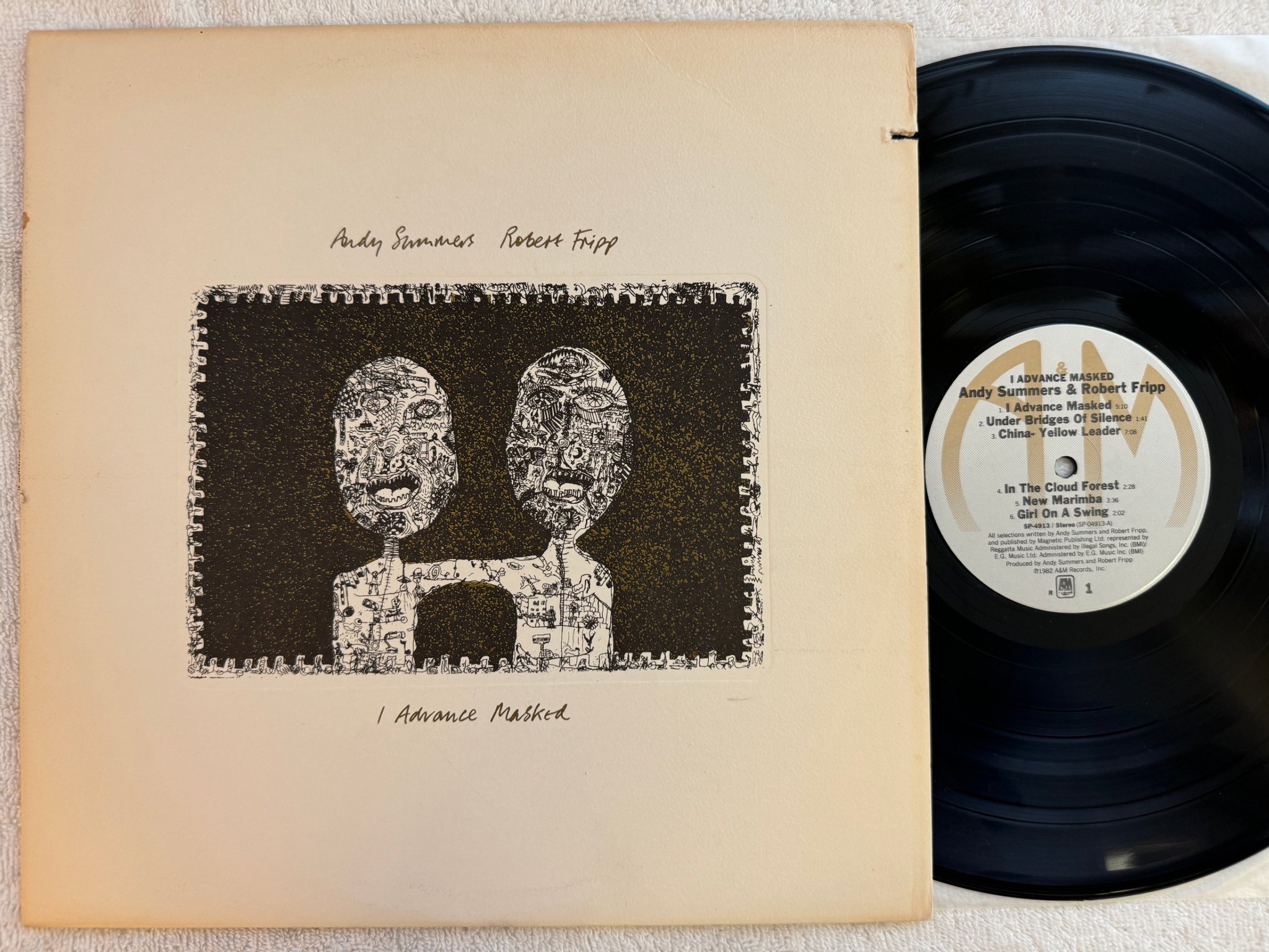 Omslagsbild för skivan ANDY SUMMERS ROBERT FRIPP advance masked LP -82 US A&M SP 4913