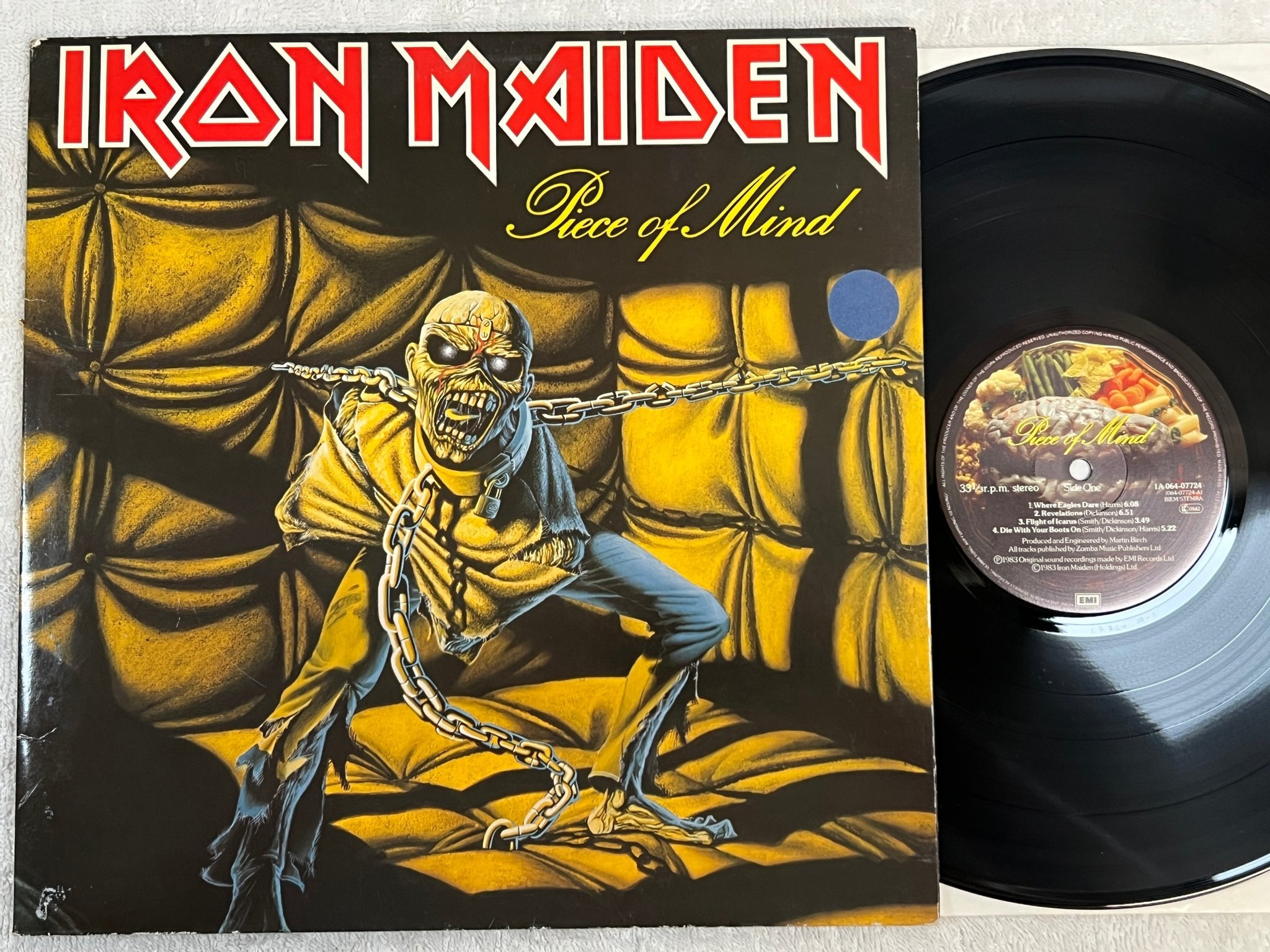 Omslagsbild för skivan IRON MAIDEN piece of mind LP -83 Hol EMI 1A 064-07724