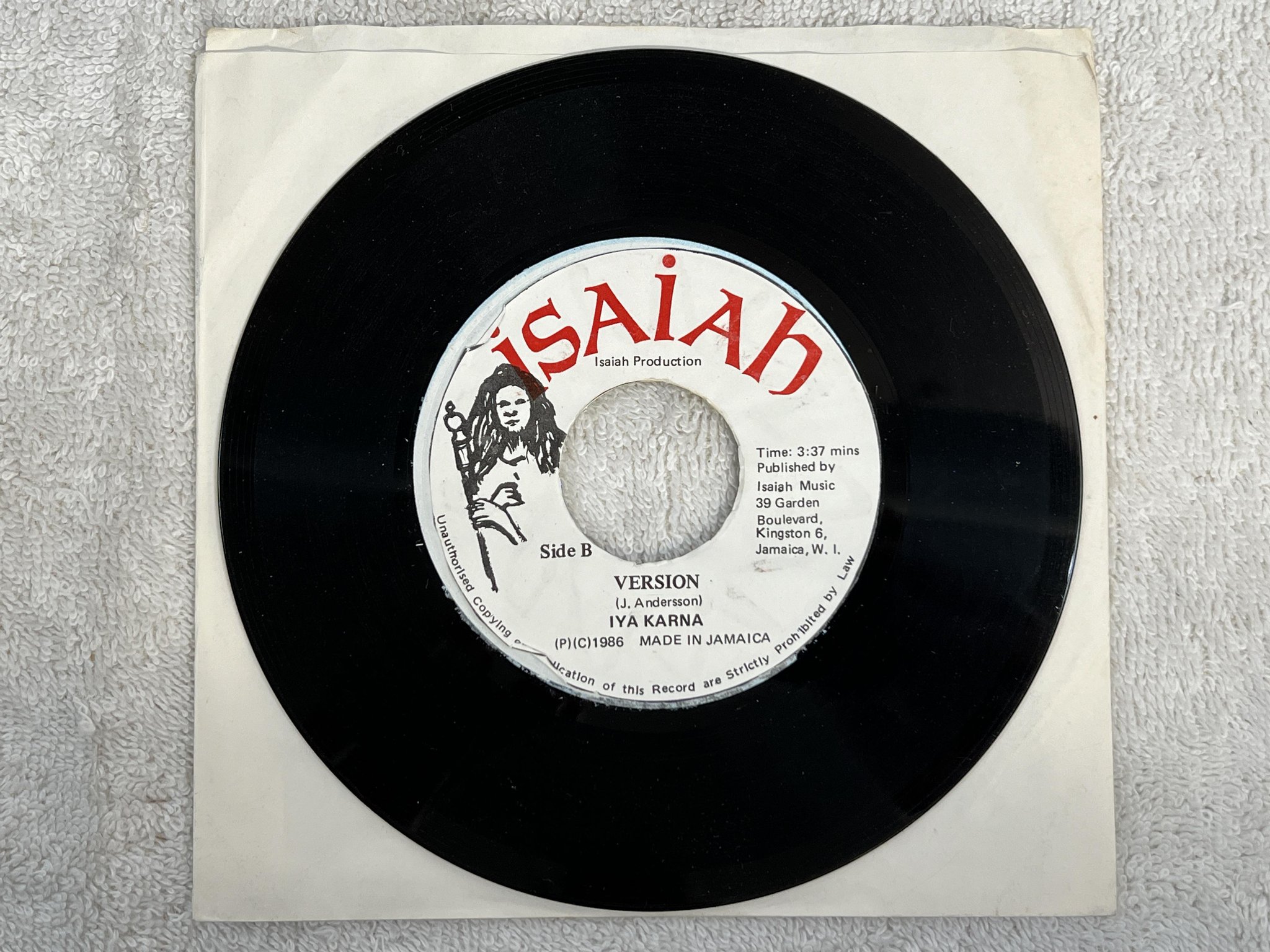 Omslagsbild för skivan IYA KARNA The Next Shot 7" -86 JAMAICA ISAIAH