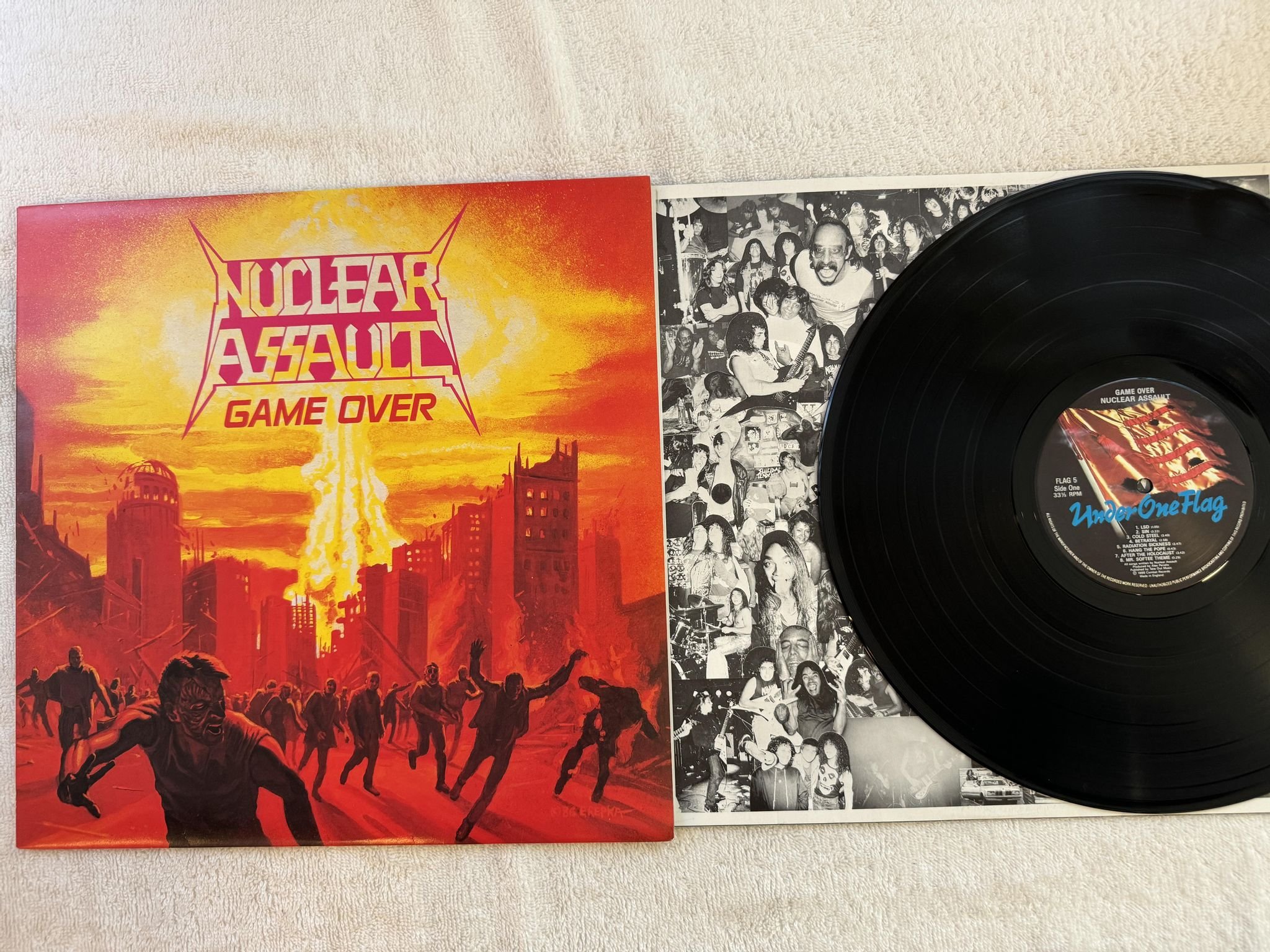 Omslagsbild för skivan NUCLEAR ASSAULT Game Over LP -86 UK UNDER ONE FLAG FLAG 5