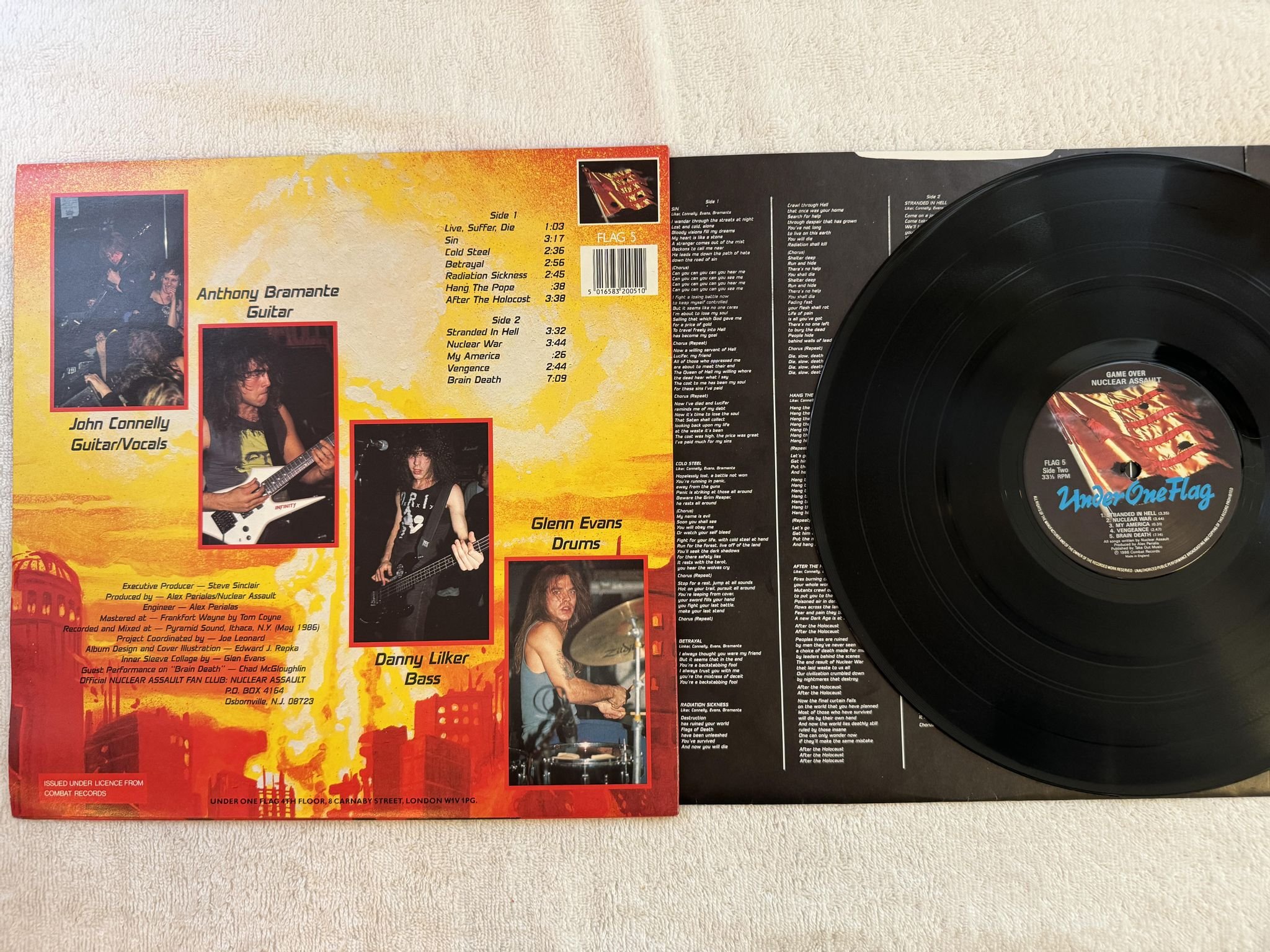 Omslagsbild för skivan NUCLEAR ASSAULT Game Over LP -86 UK UNDER ONE FLAG FLAG 5