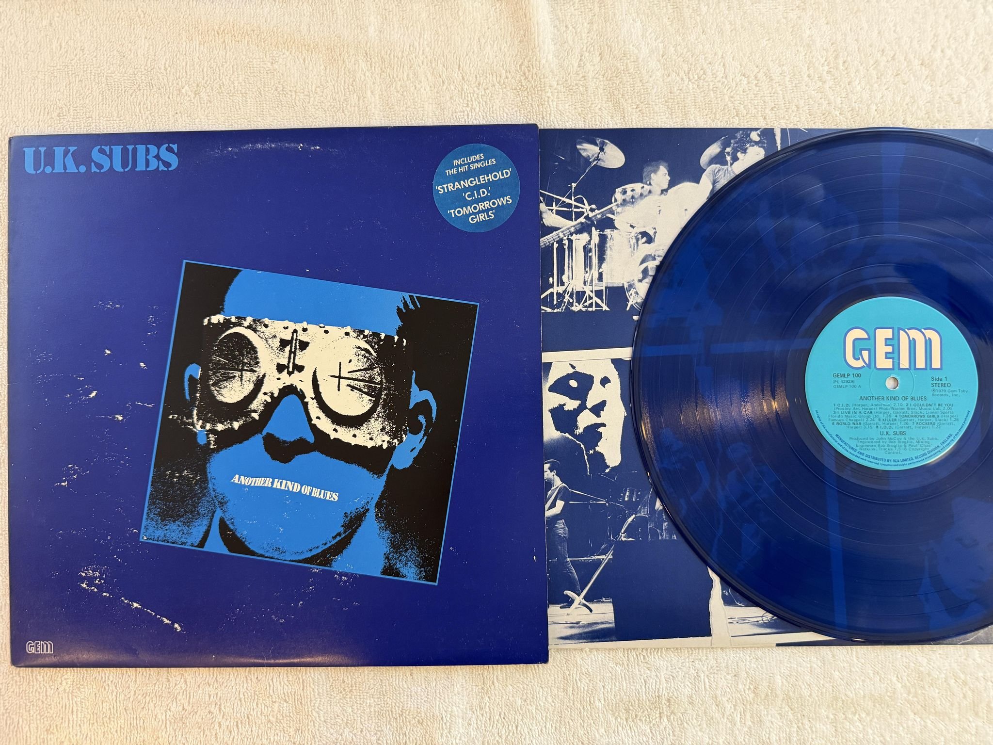 Omslagsbild för skivan UK SUBS another kind of blues LP -79 UK GEM GEMLP 100 *** BLUE VINYL ***
