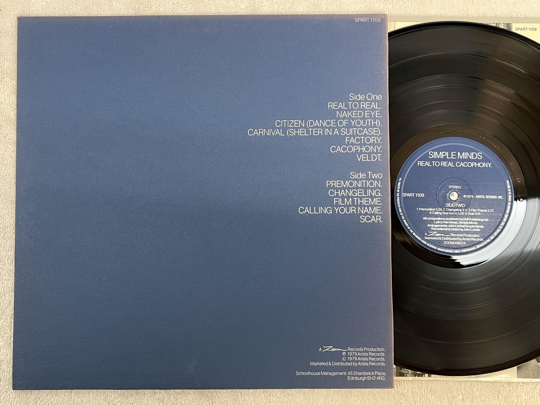 Omslagsbild för skivan SIMPLE MINDS real to real cacophony LP -79 UK ARISTA SPART-1109