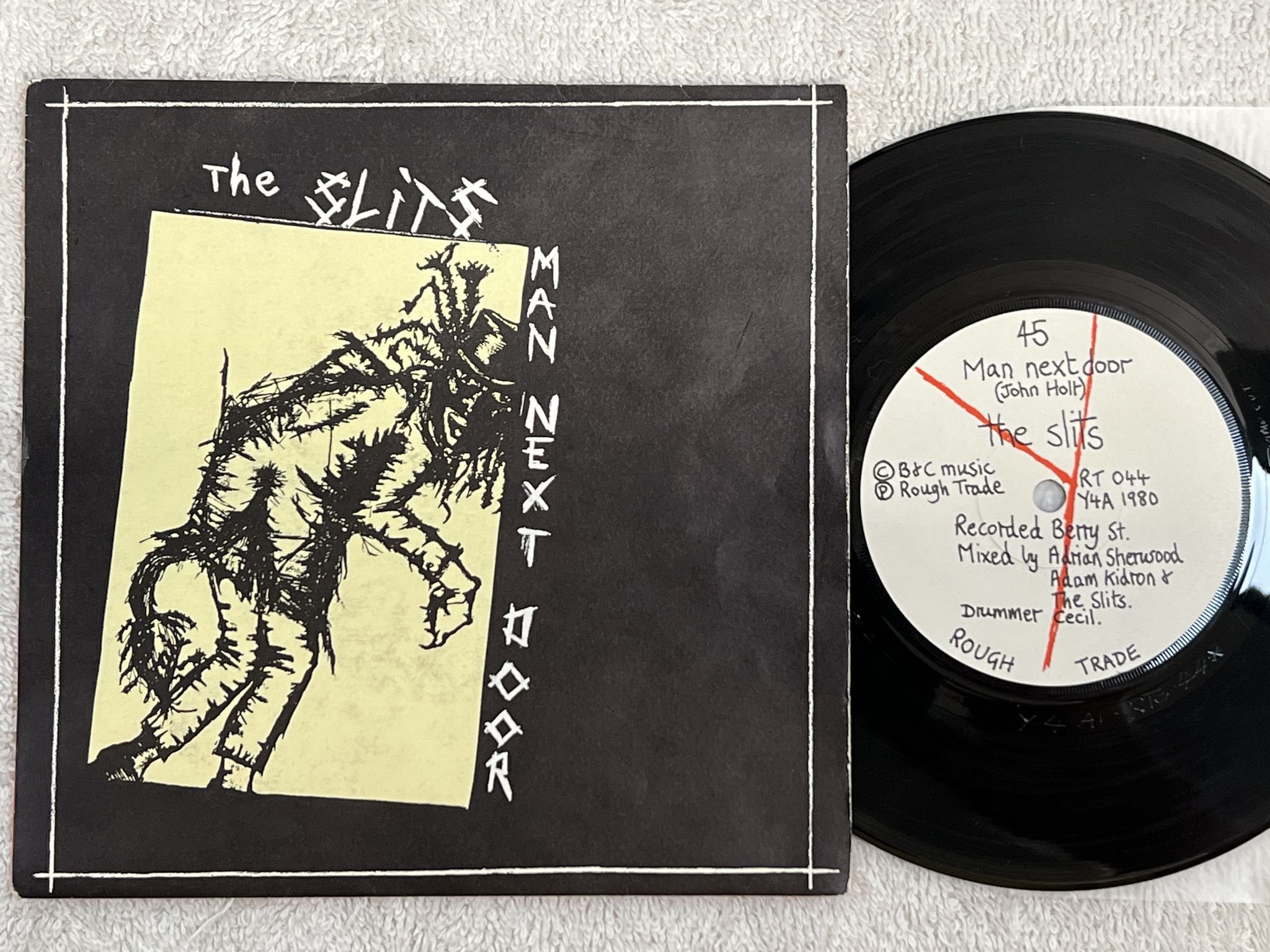 Omslagsbild för skivan THE SLITS Man Next Door 7" -80 UK ROUGH TRADE RT 044