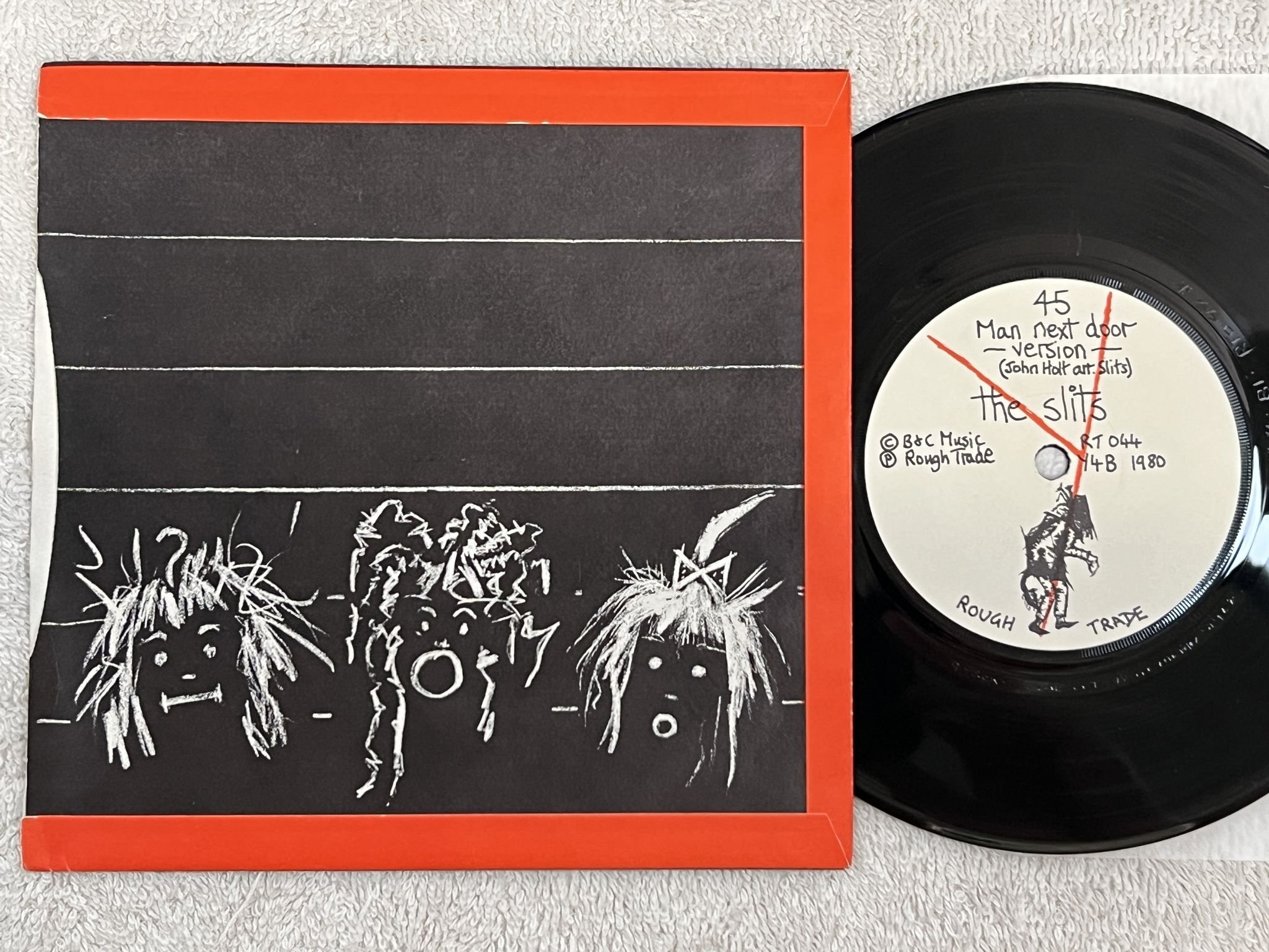 Omslagsbild för skivan THE SLITS Man Next Door 7" -80 UK ROUGH TRADE RT 044