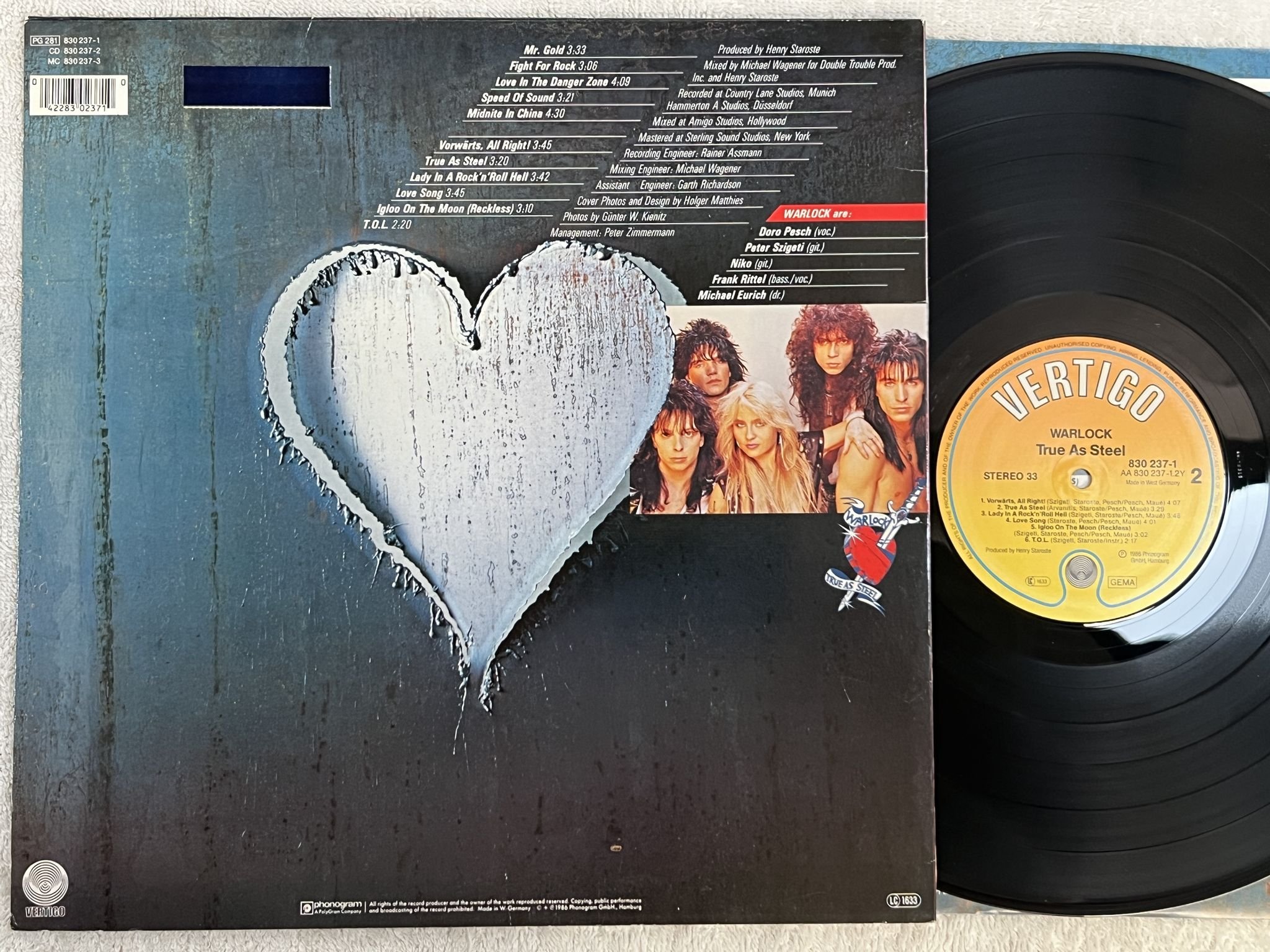 Omslagsbild för skivan WARLOCK true as steel LP -86 Ger VERTIGO 830 237-1