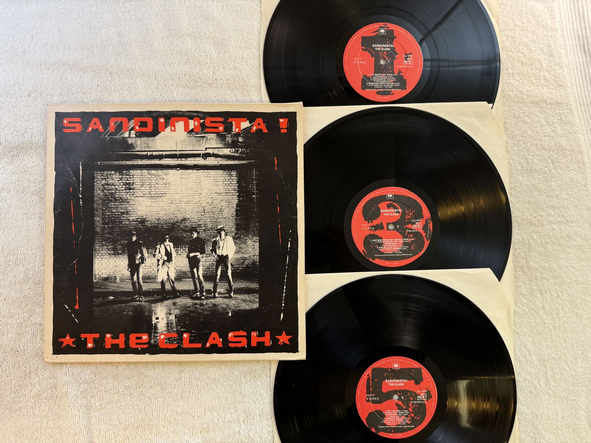 Omslagsbild för skivan THE CLASH sandinista! 3xLP -80 UK CBS FSLN-1