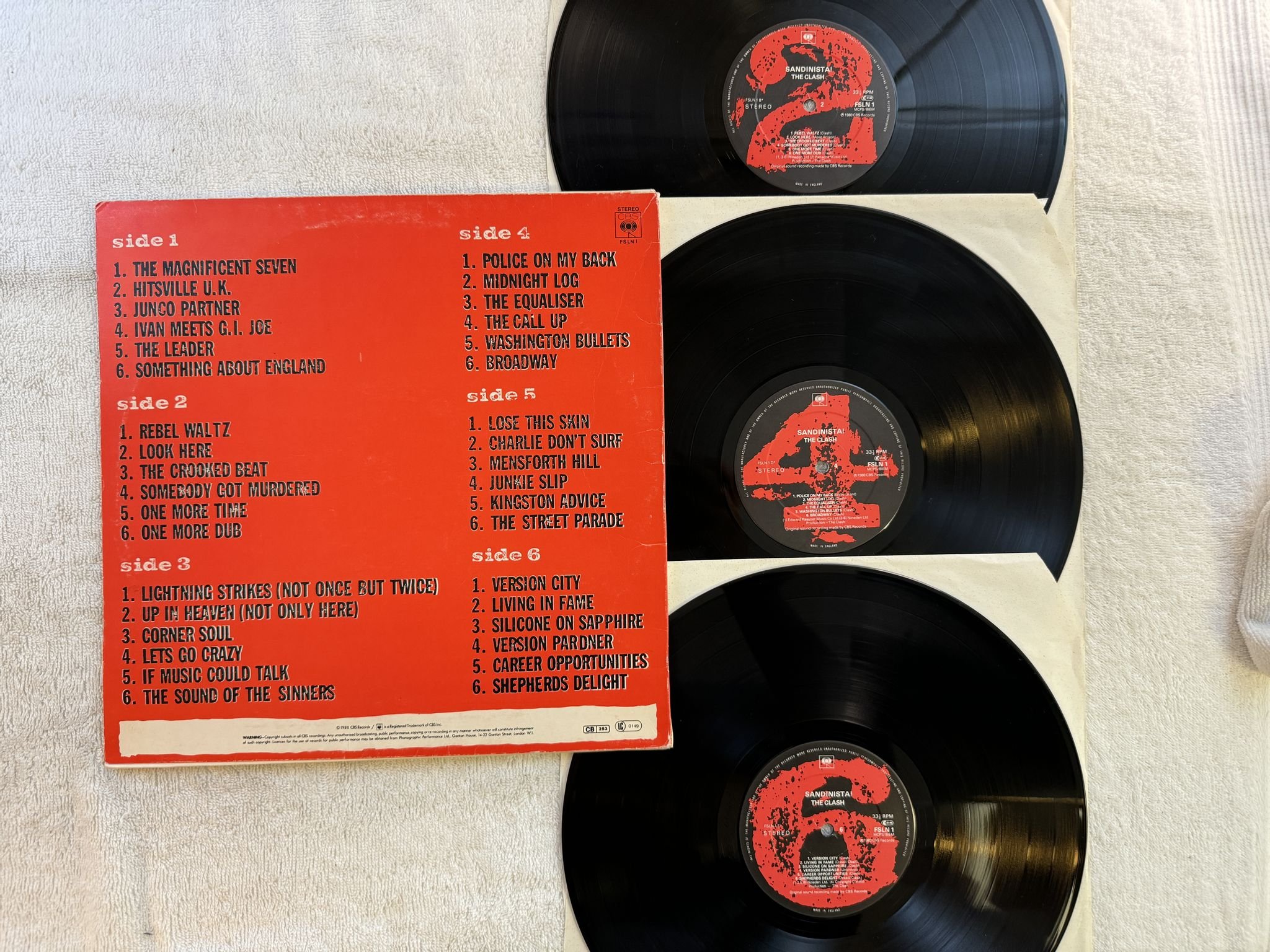 Omslagsbild för skivan THE CLASH sandinista! 3xLP -80 UK CBS FSLN-1