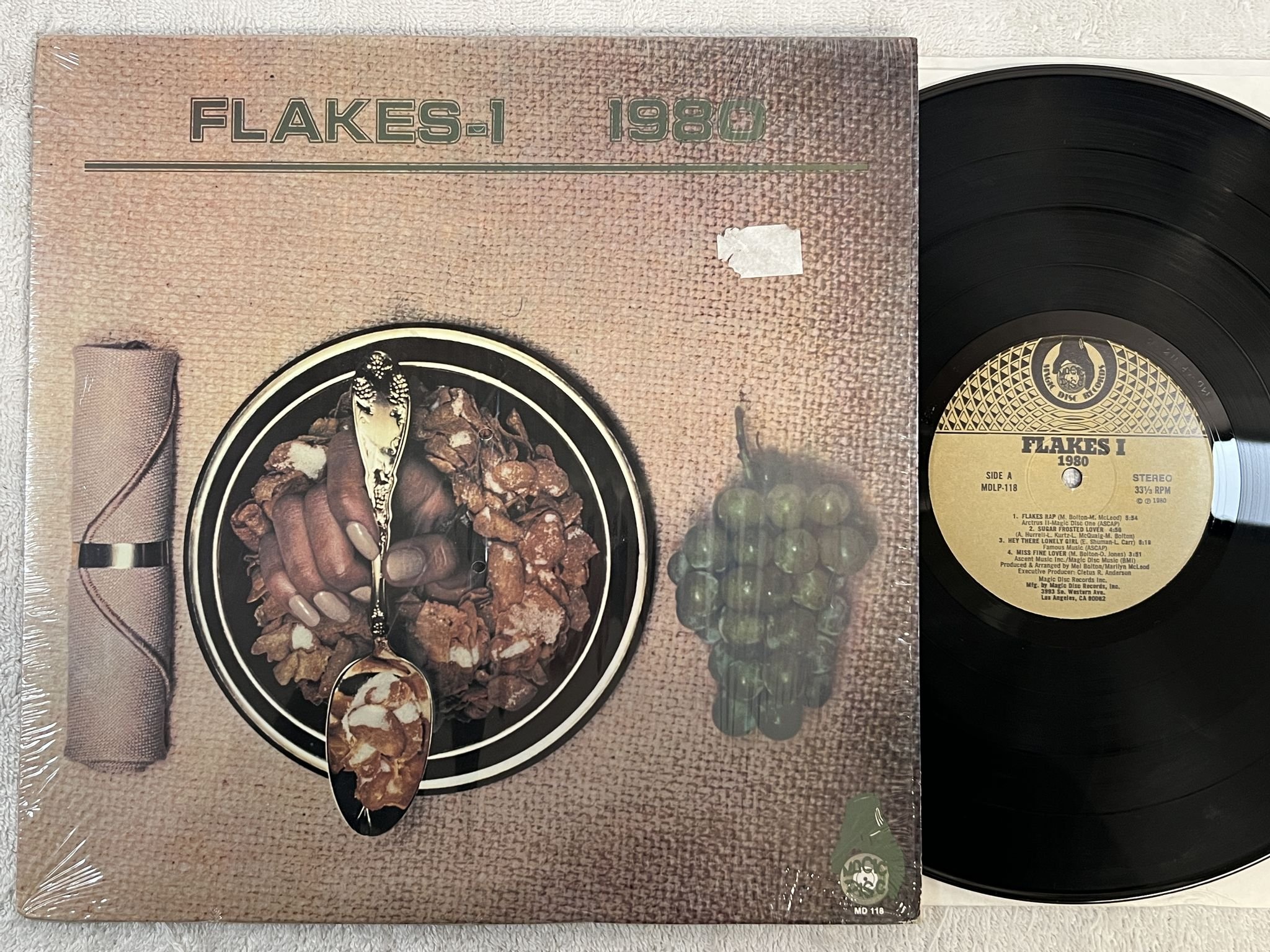 Omslagsbild för skivan FLAKES I 1980 LP -80 US MAGIC DISC MDLP 118 ** DISCO / FUNK **