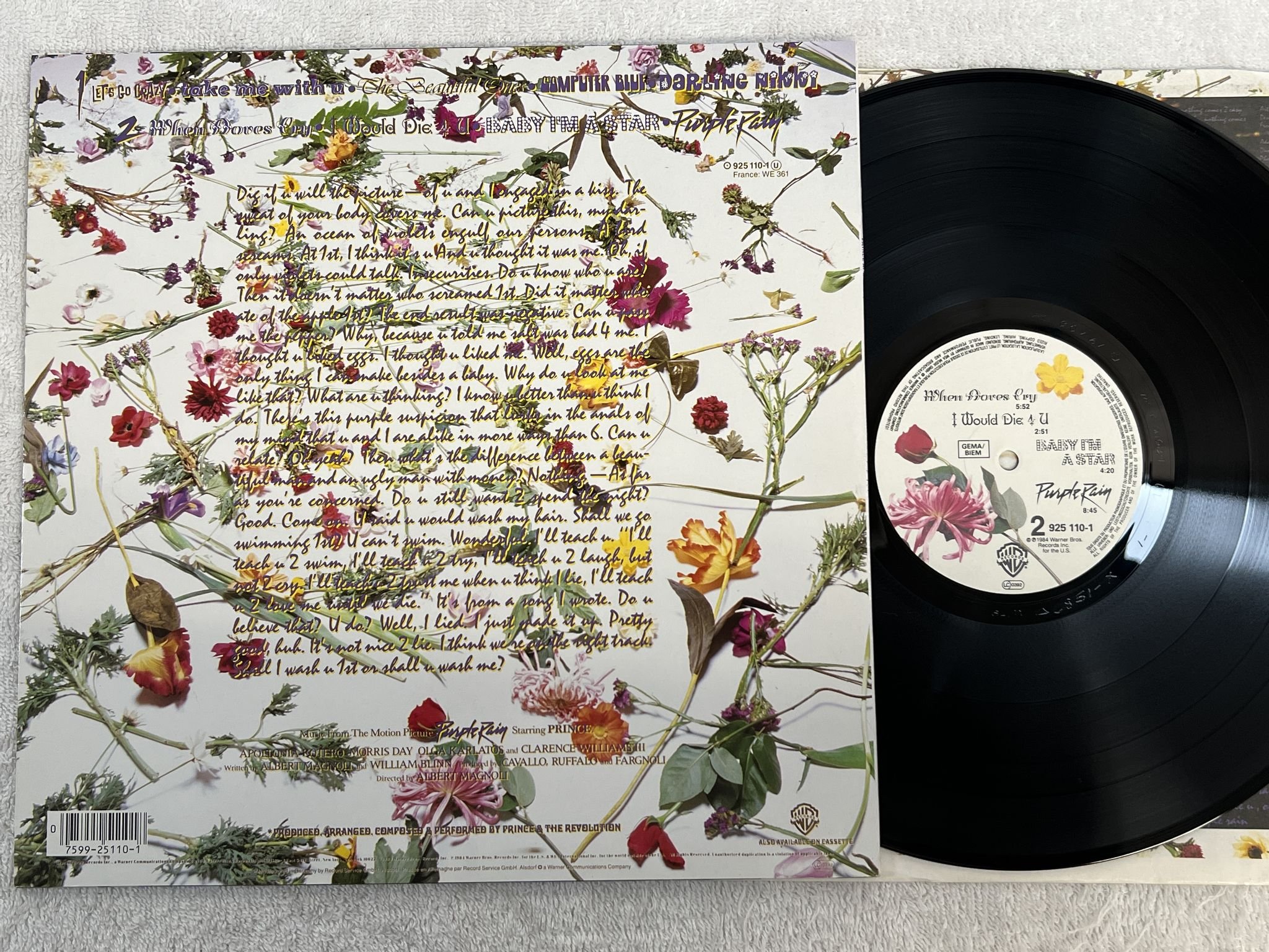 Omslagsbild för skivan PRINCE AND THE REVOLUTION purple rain LP -84 WARNER 925 110-1 ** w/ Poster **