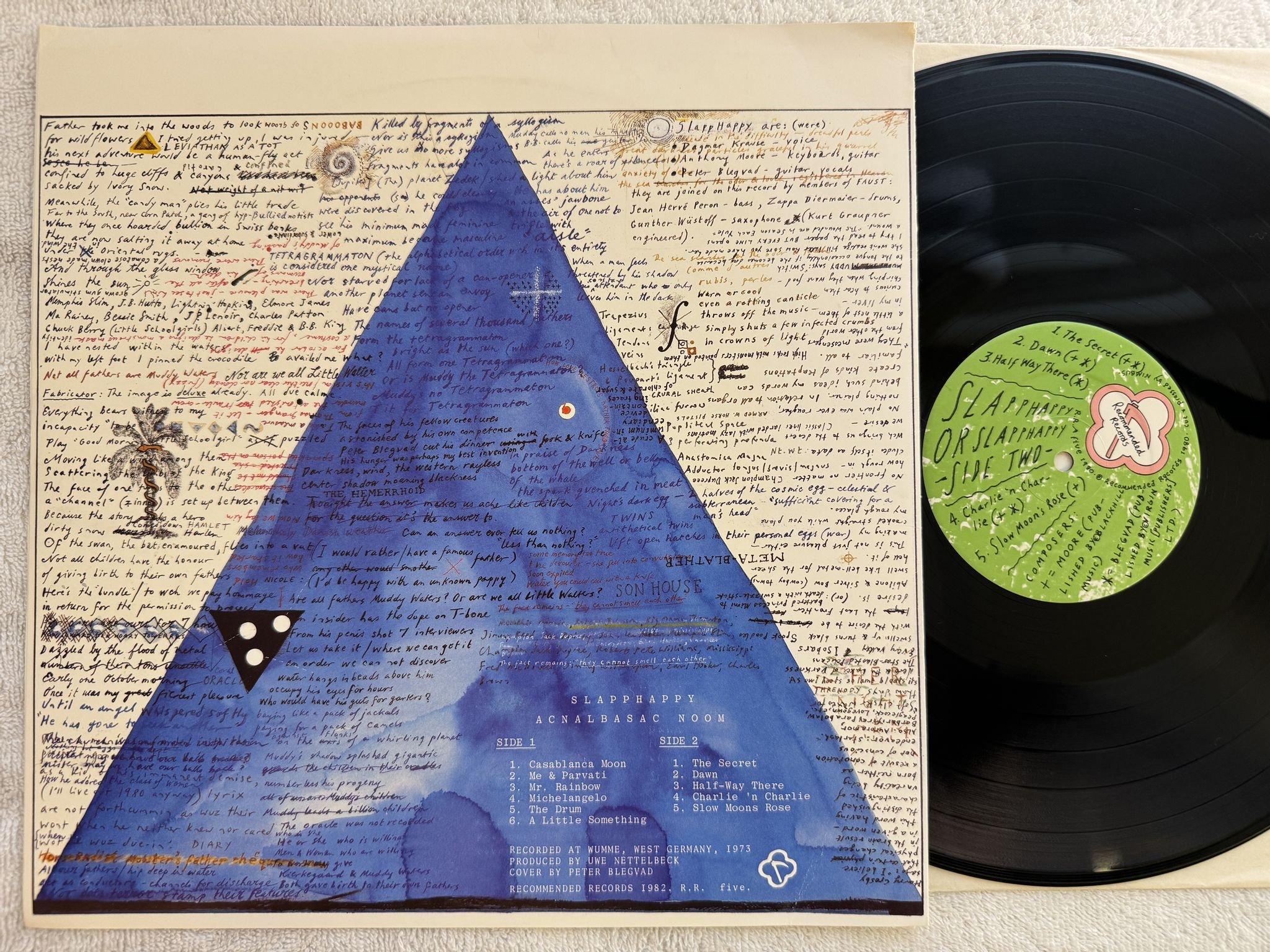 Omslagsbild för skivan SLAPP HAPPY Acnalbasac Noom LP -82 UK recommended R.R. five