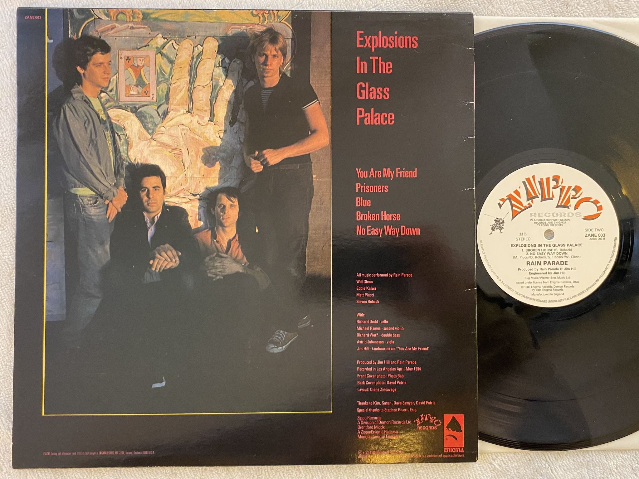 Omslagsbild för skivan RAIN PARADE Explosions In The Glass Palace 12"EP -84 UK ZIPPO ZANE 003