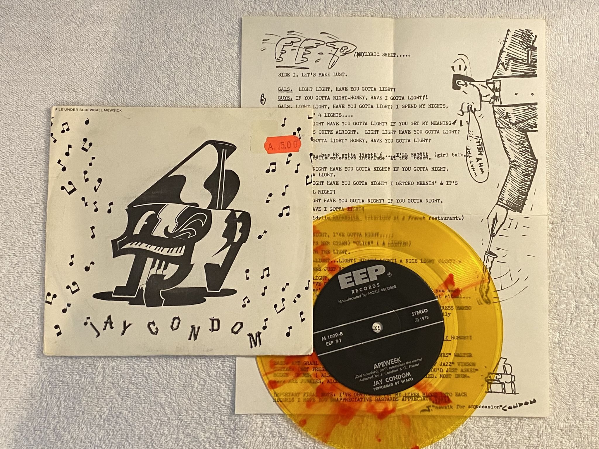 Omslagsbild för skivan JAY CONDOM let's make lust 7" -78 US EEP #1 *** Yellow W/ Red Splatter ***