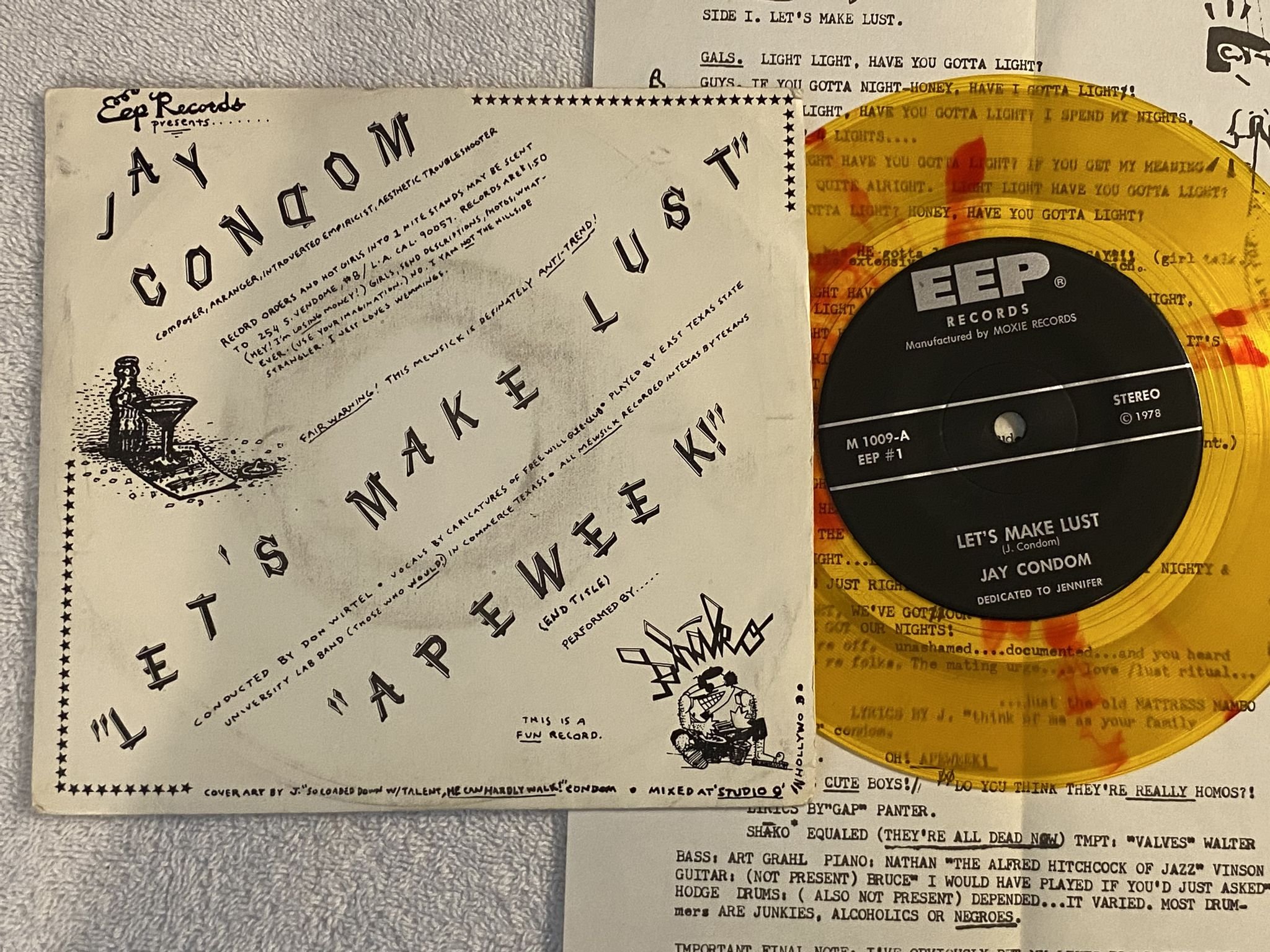 Omslagsbild för skivan JAY CONDOM let's make lust 7" -78 US EEP #1 *** Yellow W/ Red Splatter ***