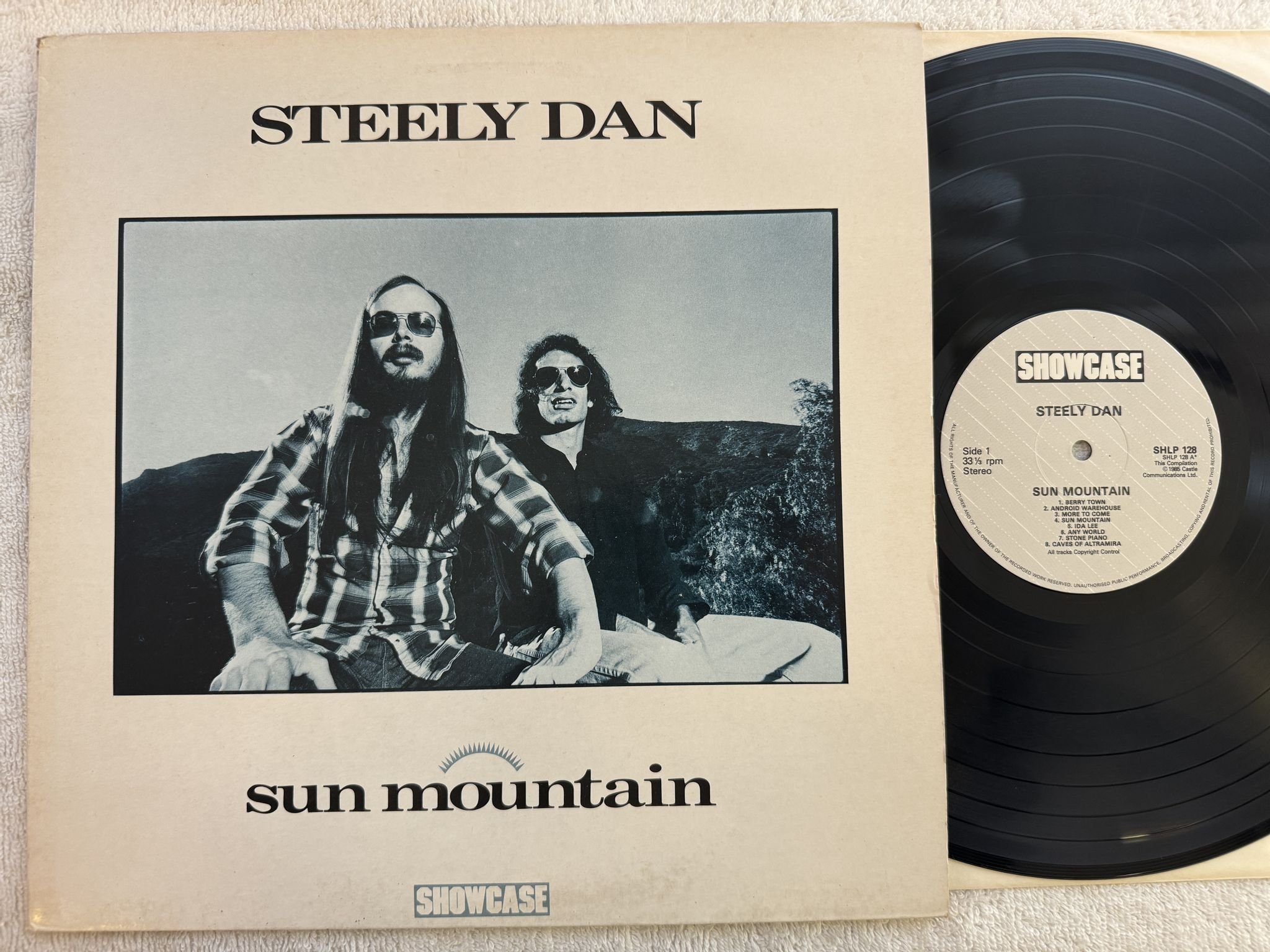 Omslagsbild för skivan STEELY DAN sun mountain LP -85 UK SHOWCASE SHLP 128