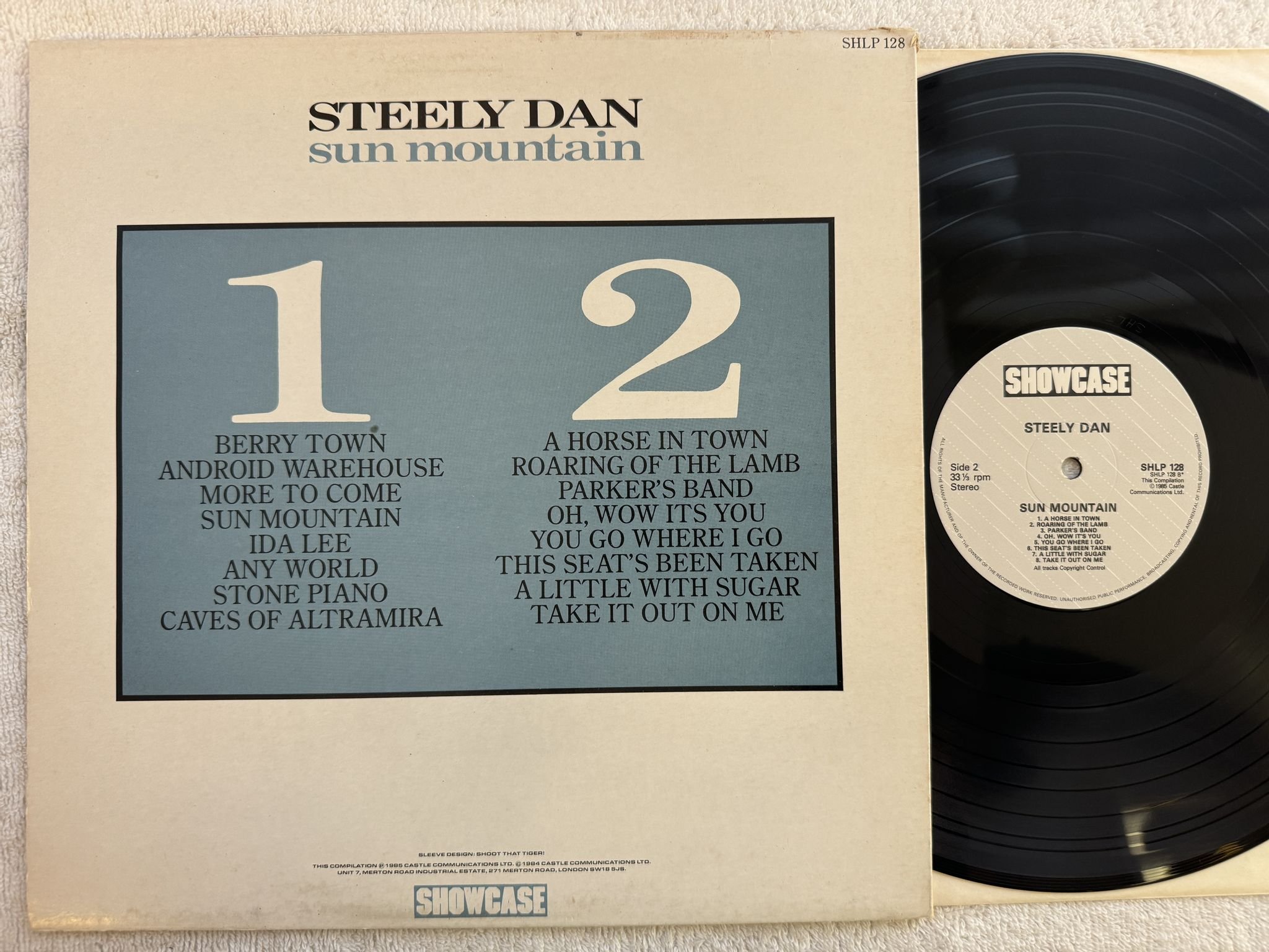 Omslagsbild för skivan STEELY DAN sun mountain LP -85 UK SHOWCASE SHLP 128