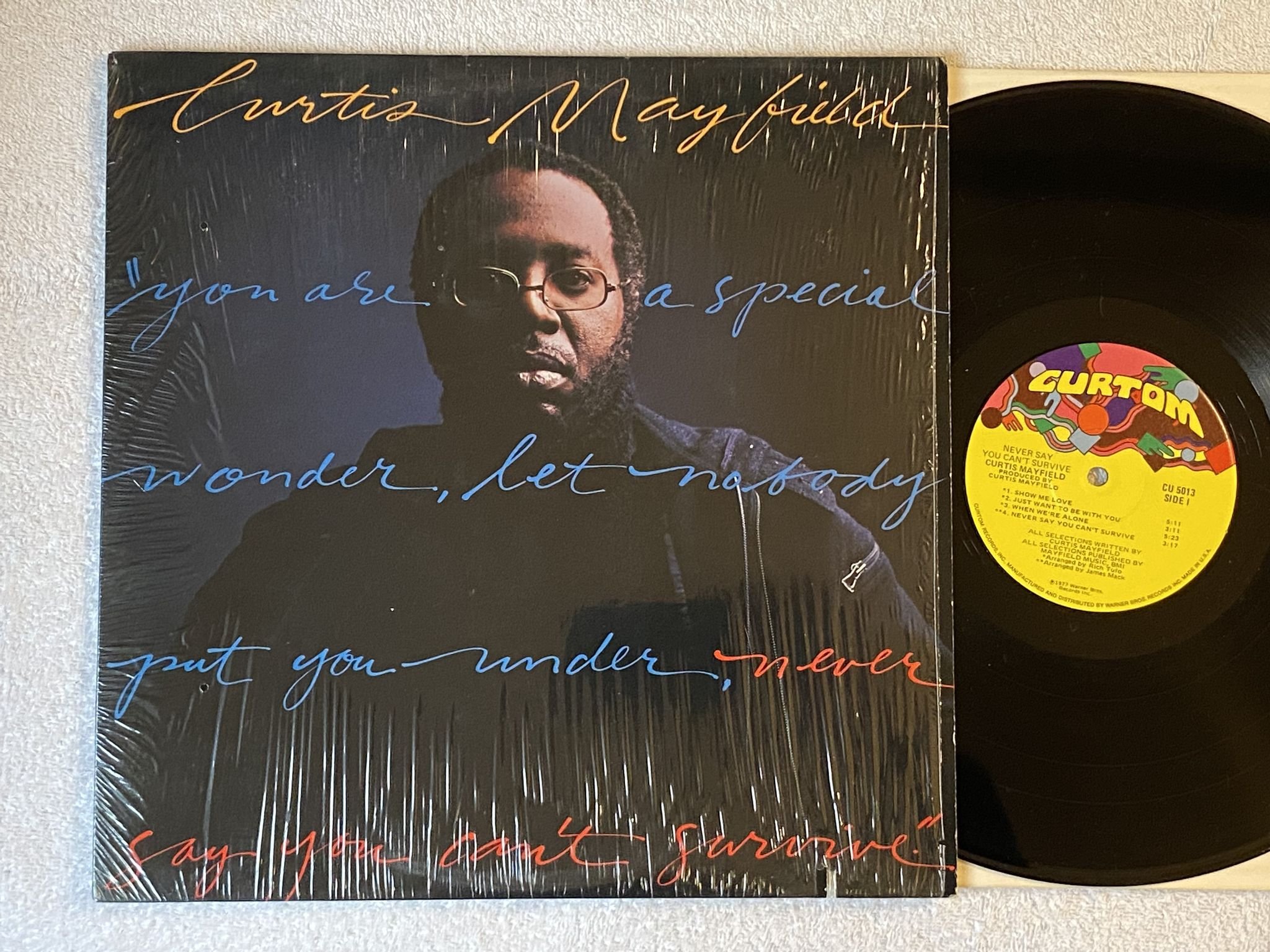 Omslagsbild för skivan CURTIS MAYFIELD never say you can't survive LP -77 US CURTOM CU 5013