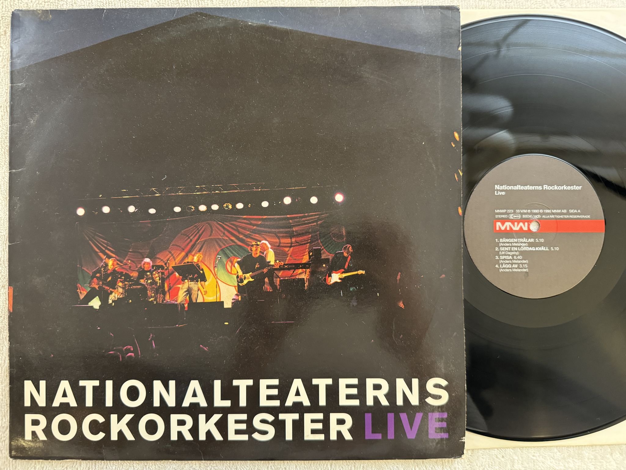Omslagsbild för skivan NATIONALTEATERNS ROCKORKESTER live LP -90 Swe MNW MNWP 223