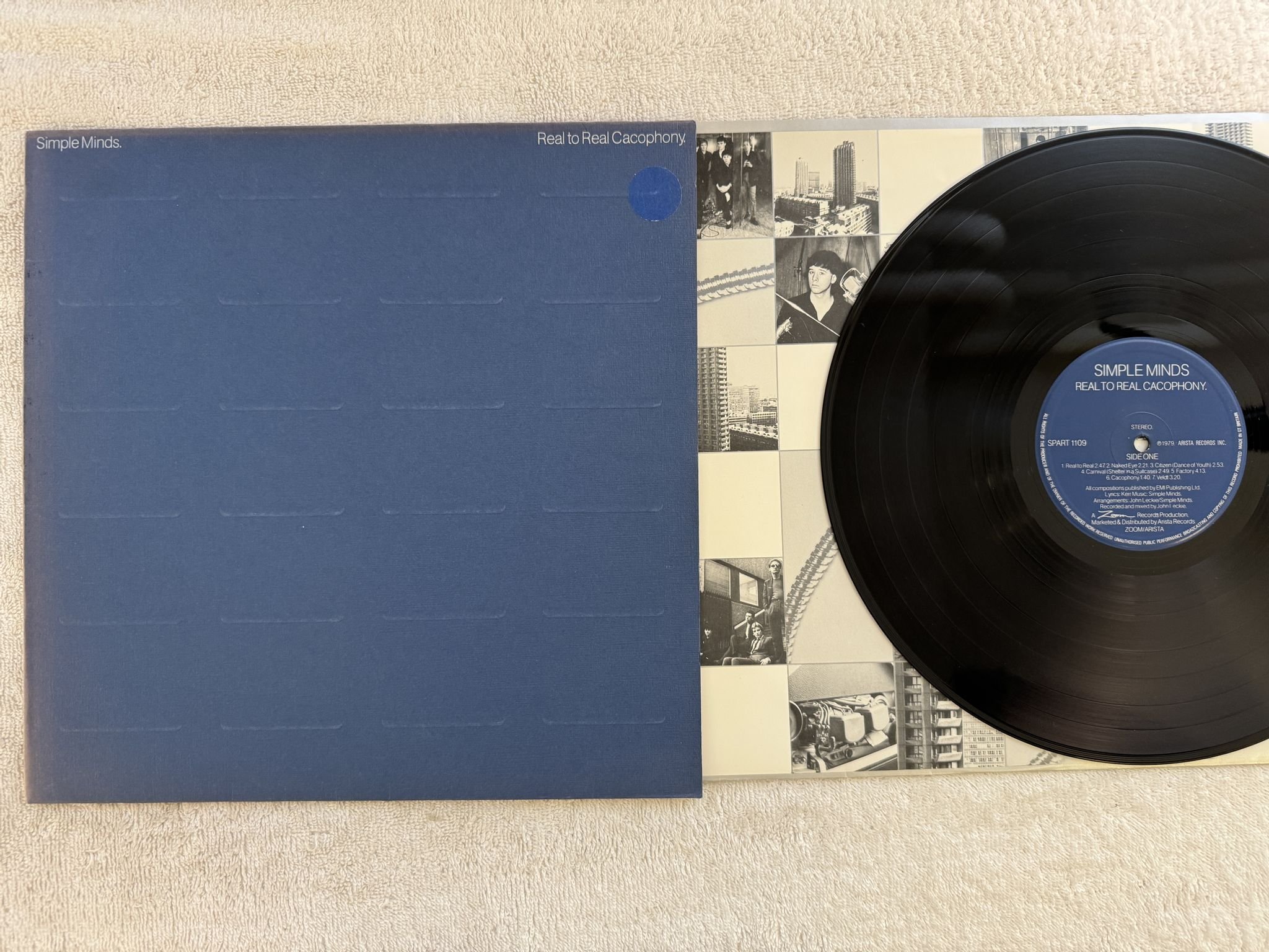 Omslagsbild för skivan SIMPLE MINDS real to real cacophony LP -79 UK ARISTA SPART 1109