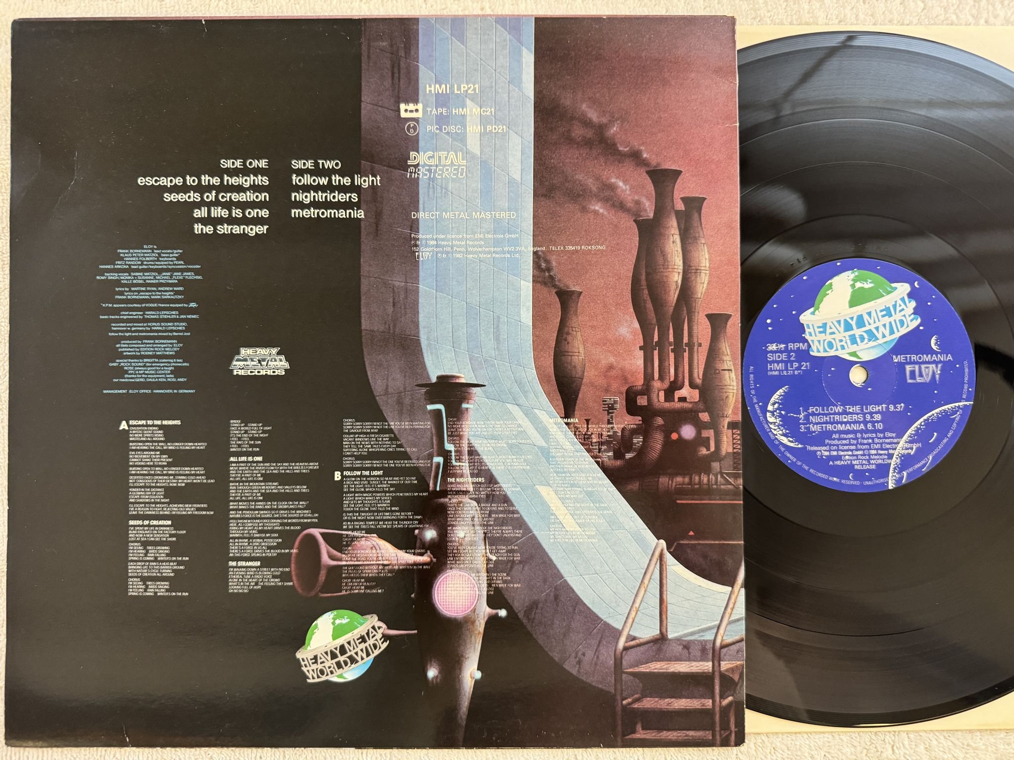 Omslagsbild för skivan ELOY metromania LP -84 UK HEAVY METAL WORLD WIDE HMI LP 21