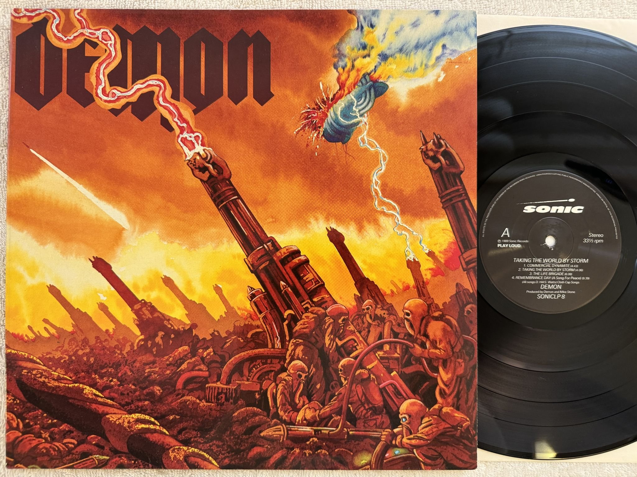 Omslagsbild för skivan DEMON taking the world by storm LP -89 UK SONIC SONICLP 8
