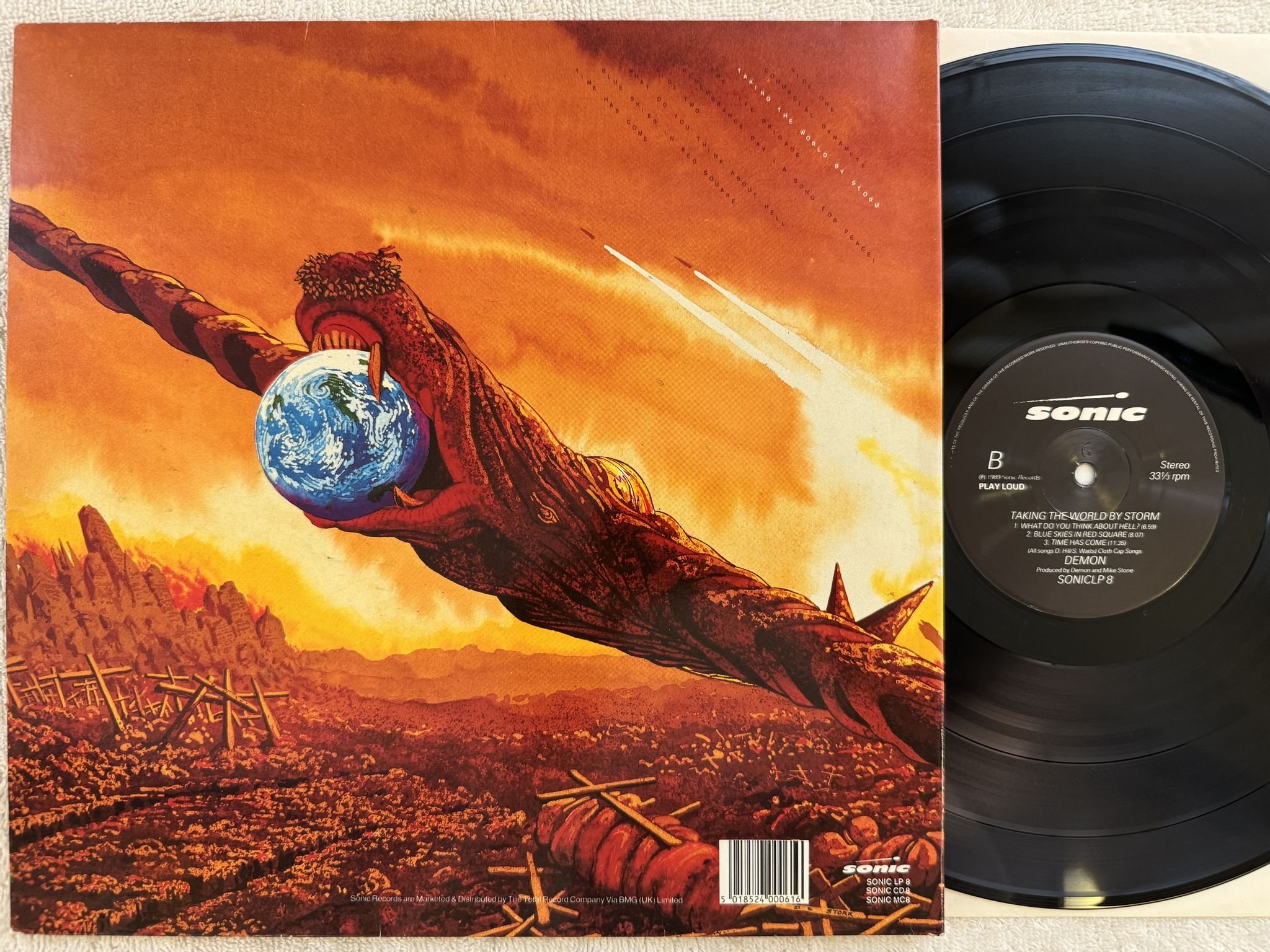 Omslagsbild för skivan DEMON taking the world by storm LP -89 UK SONIC SONICLP 8