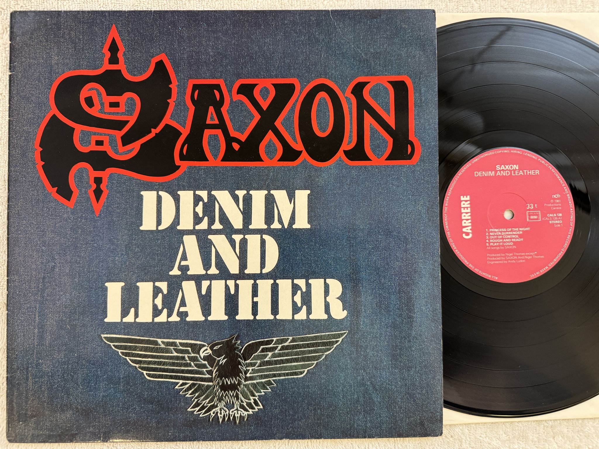 Omslagsbild för skivan SAXON denim and leather LP -81 ncb CARRERE CALS 128