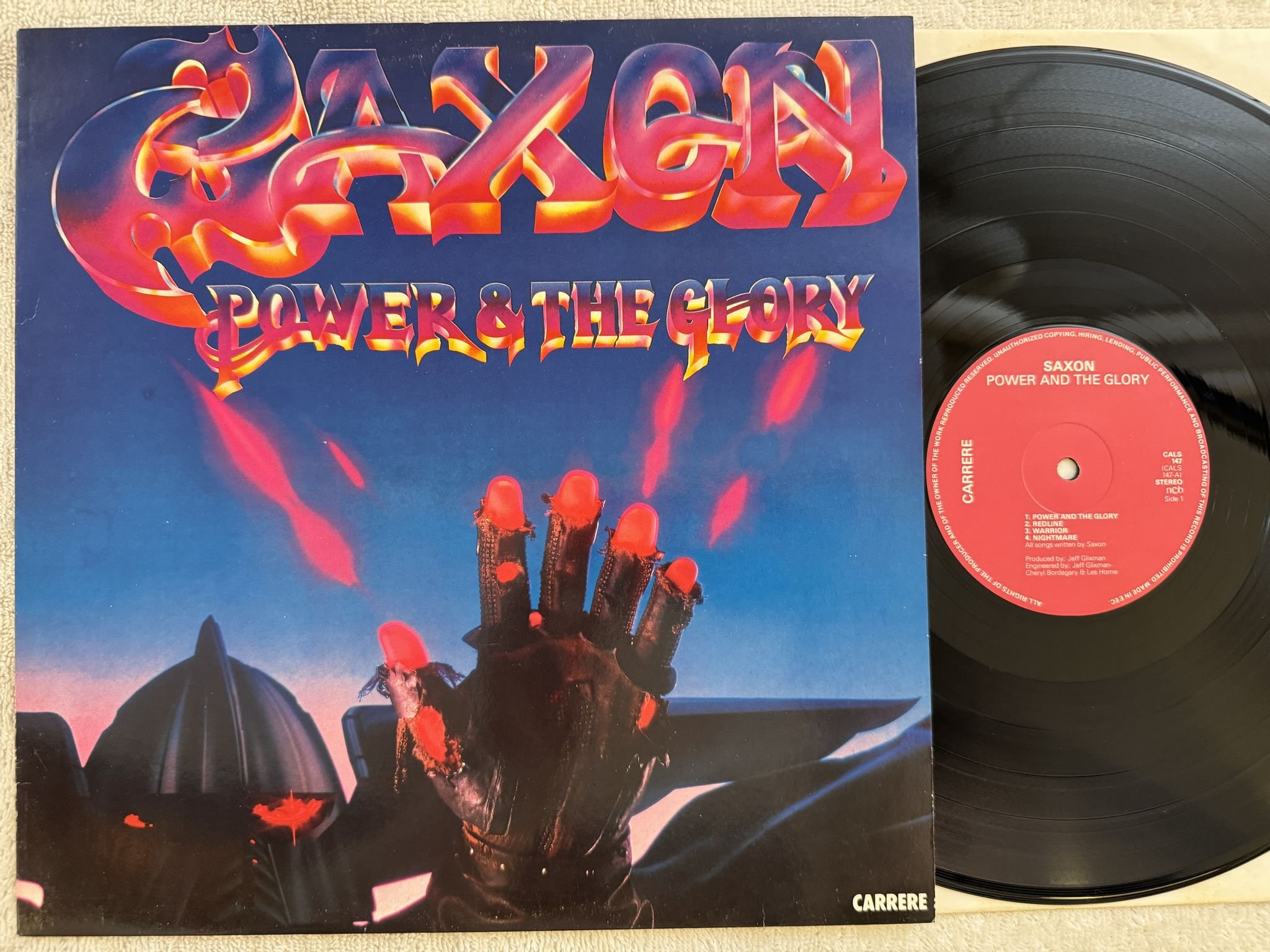 Omslagsbild för skivan SAXON Power & The Glory LP -83 ncb CARRERE CALS 147