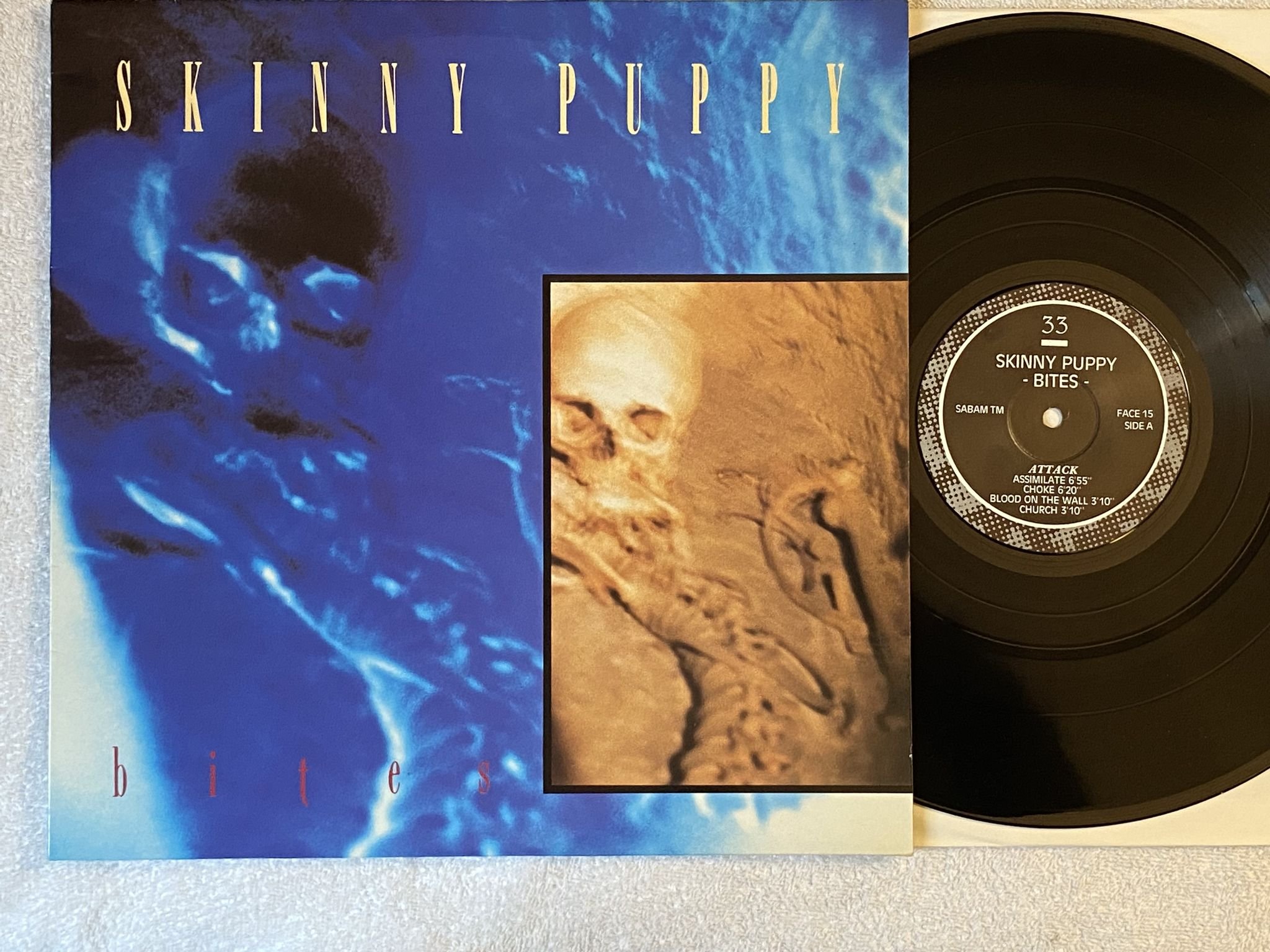 Omslagsbild för skivan SKINNY PUPPY bites LP -85 Belgium SCARFACE FACE 15