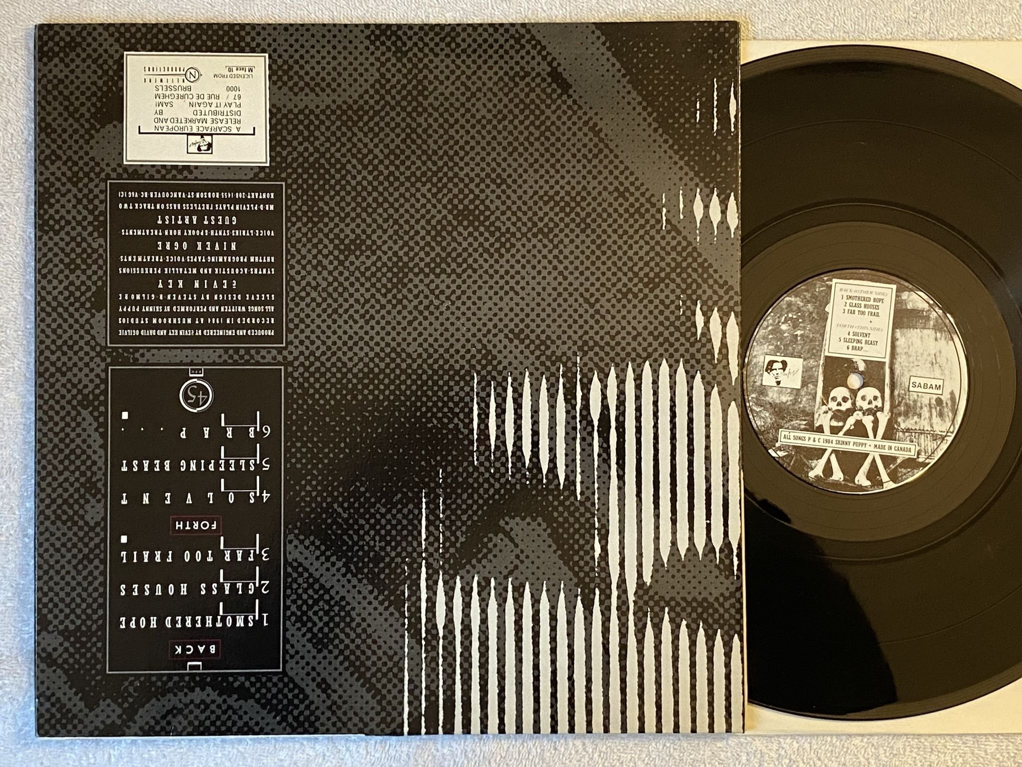 Omslagsbild för skivan SKINNY PUPPY Remission LP -84 Belgium SCARFACE M face 10