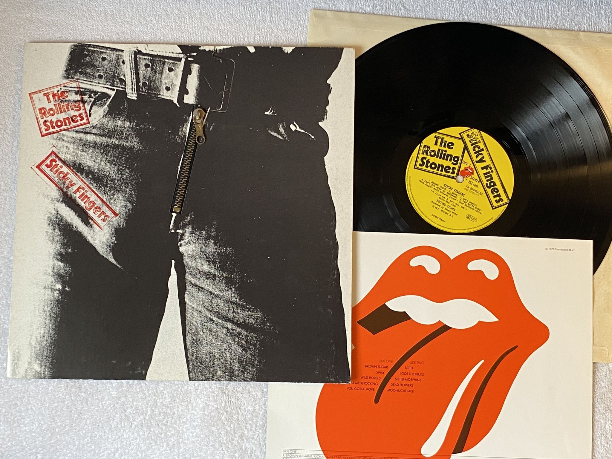 Omslagsbild för skivan ROLLING STONES sticky fingers LP re Ger 1A 064-63152 ** Andy Warhol art cover **