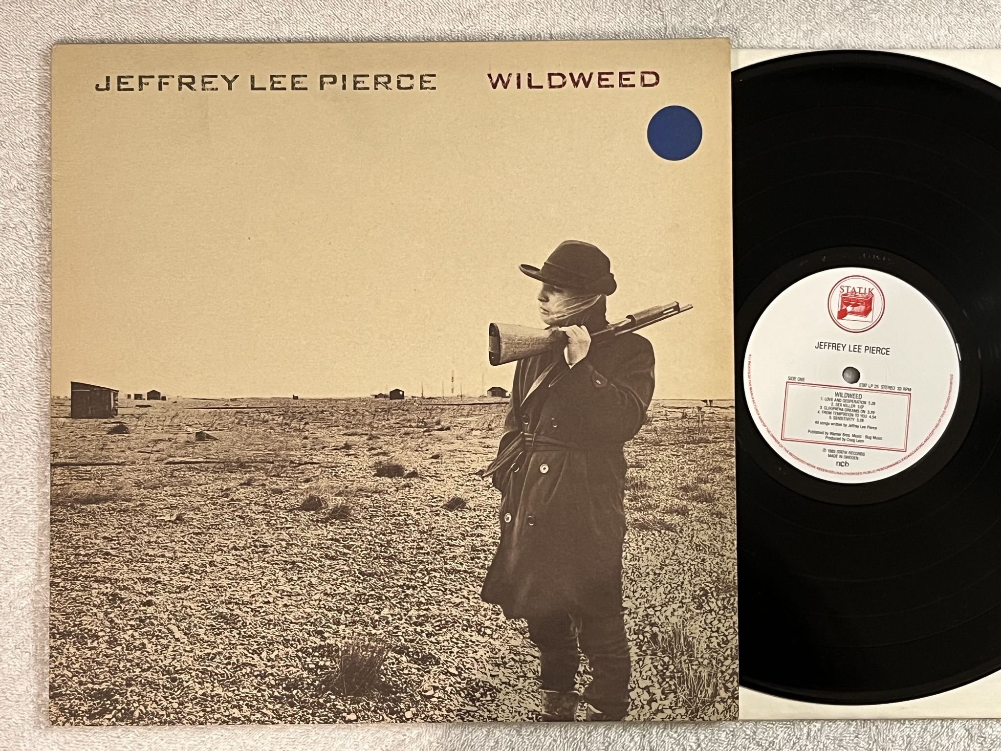 Omslagsbild för skivan JEFFREY LEE POERCE Wildweed LP -85 ncb statik stat LP 25