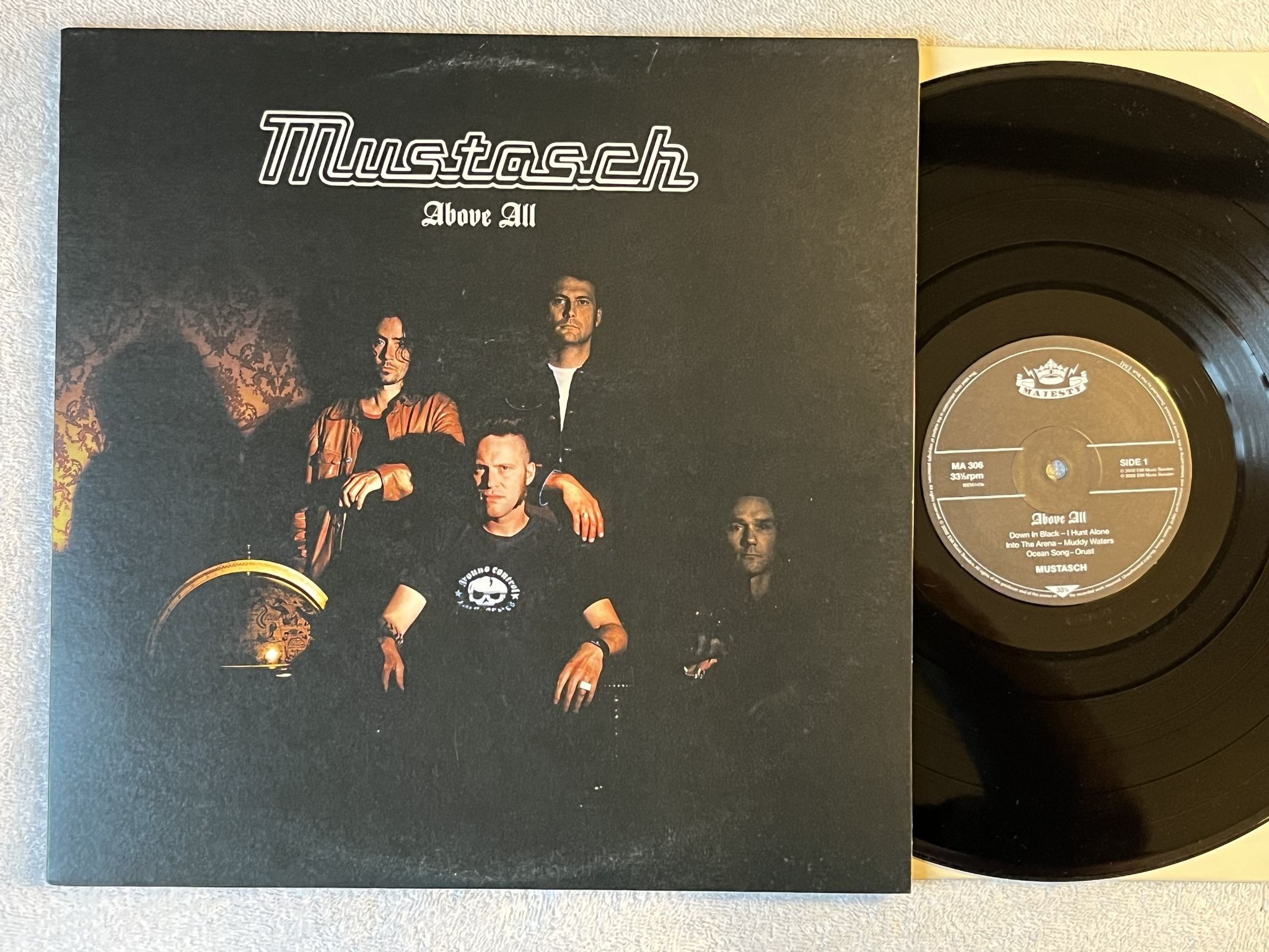 Omslagsbild för skivan MUSTASCH above all LP 2002 Swe MAJESTY MA 306