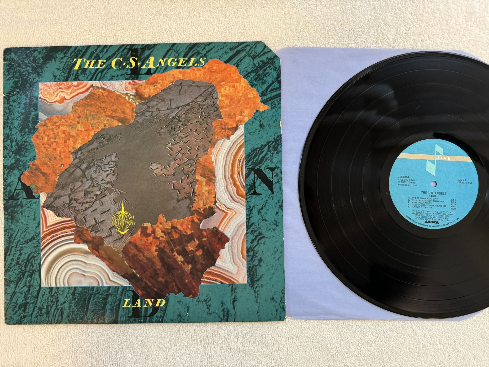 Omslagsbild för skivan THE COMSAT ANGELS Land LP -83 US JIVE JL8-8184