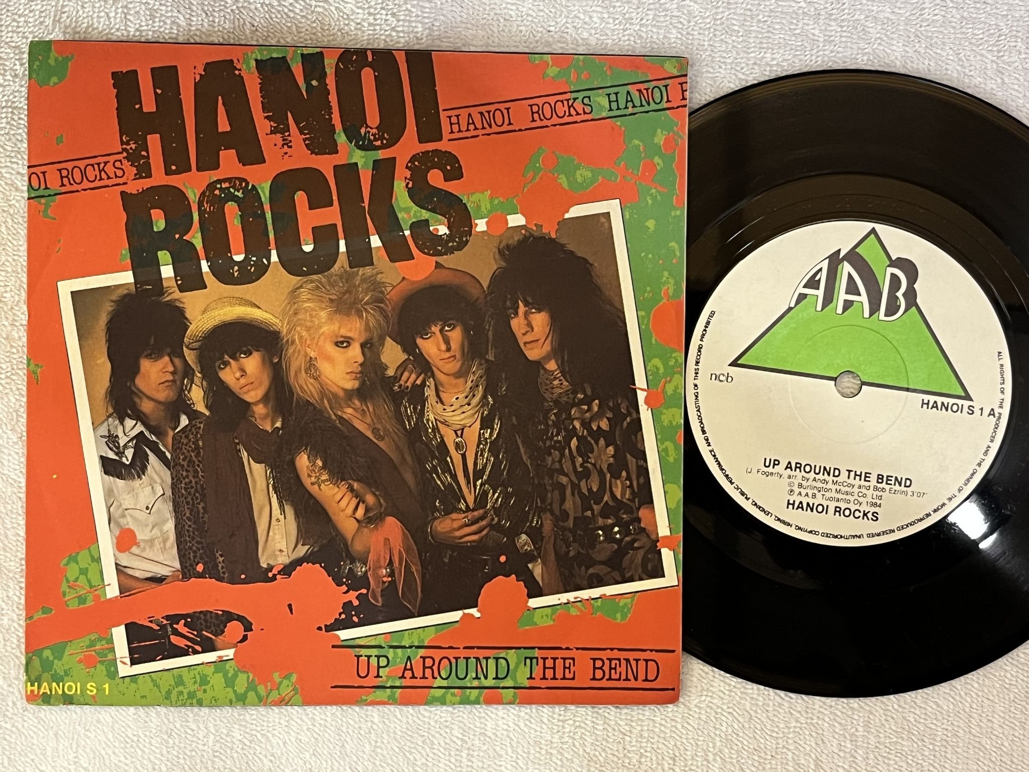 Omslagsbild för skivan HANOI ROCKS up around the bend 7"single -84 ncb AAB HANOI S 1