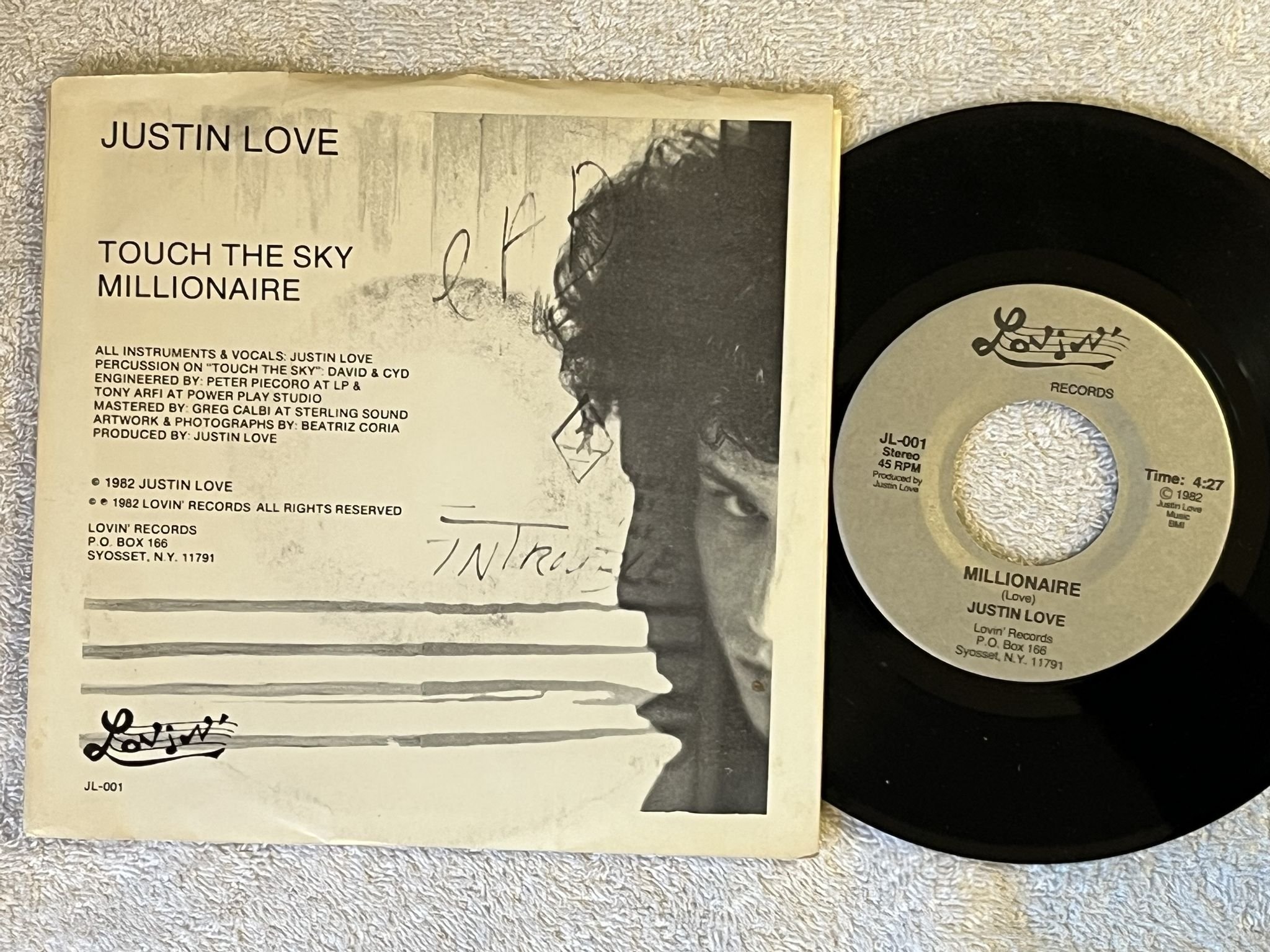 Omslagsbild för skivan JUSTIN LOVE TOUCH THE SKY 7" -82 US LOVIN' JL-001 SYNTH