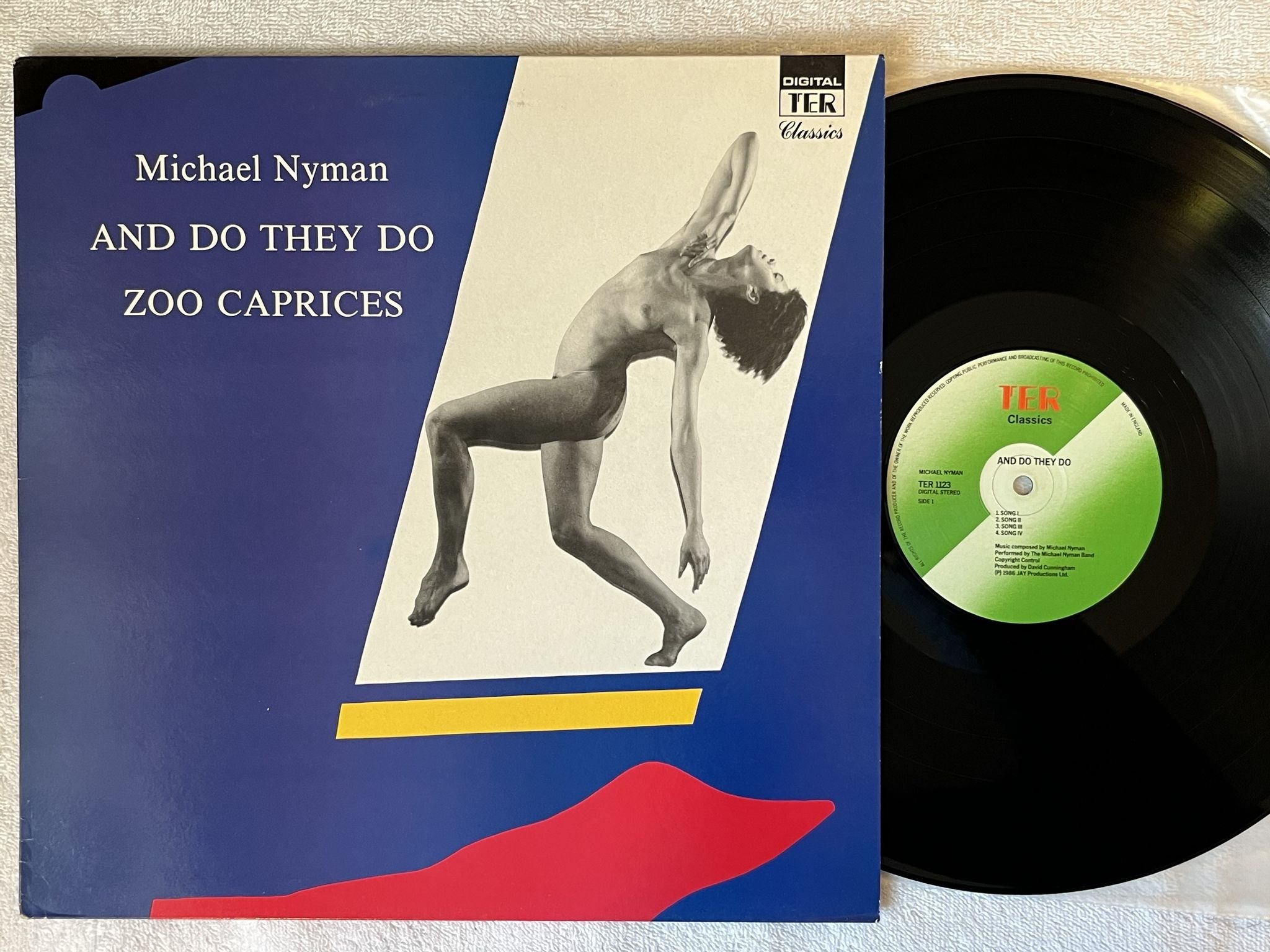 Omslagsbild för skivan MICHAEL NYMAN And Do They Do / Zoo Caprices LP -86 UK TER 1123