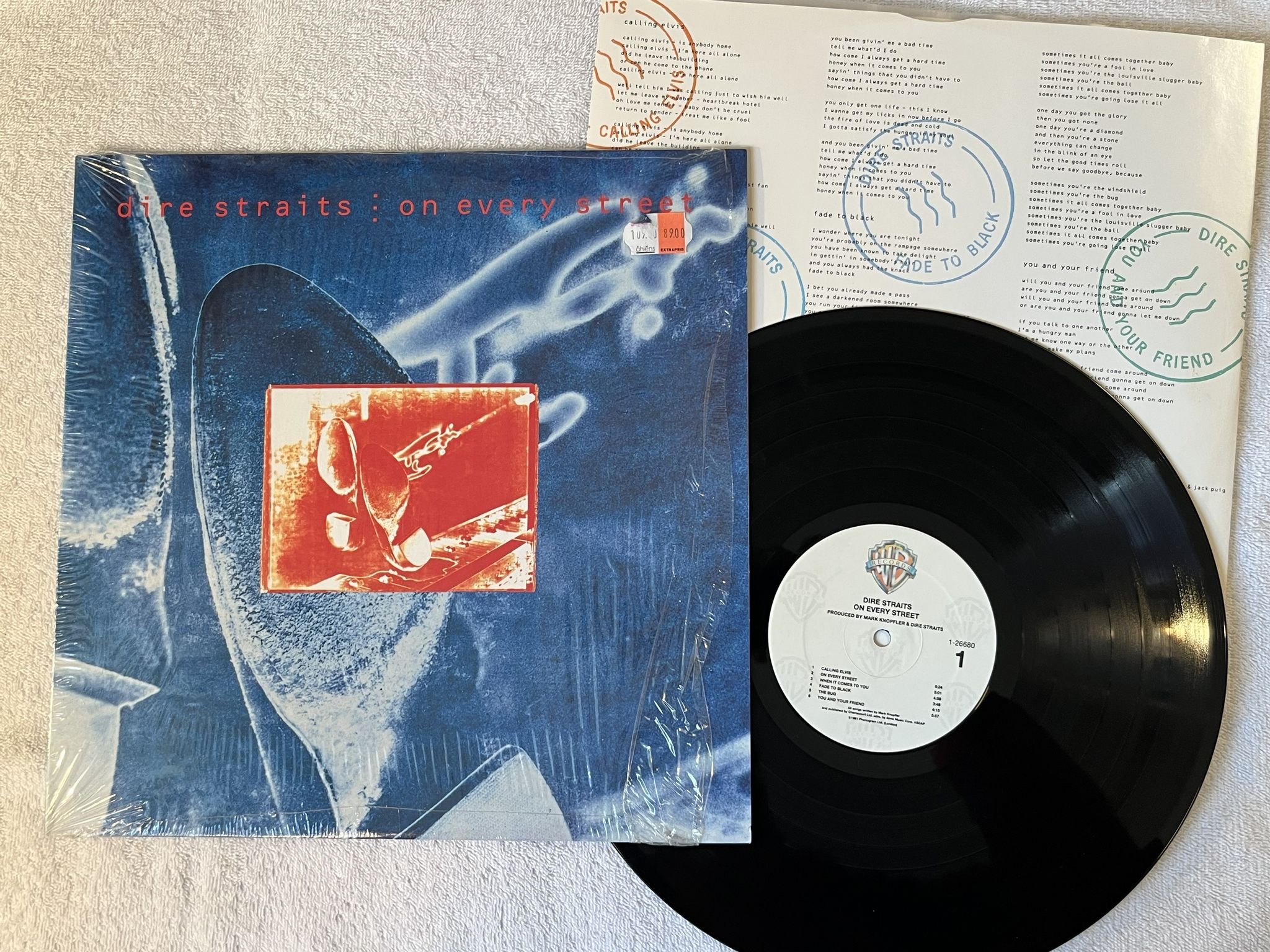 Omslagsbild för skivan DIRE STRAITS On Every Street LP -91 US warner 1-26680 *** Rare US press ***