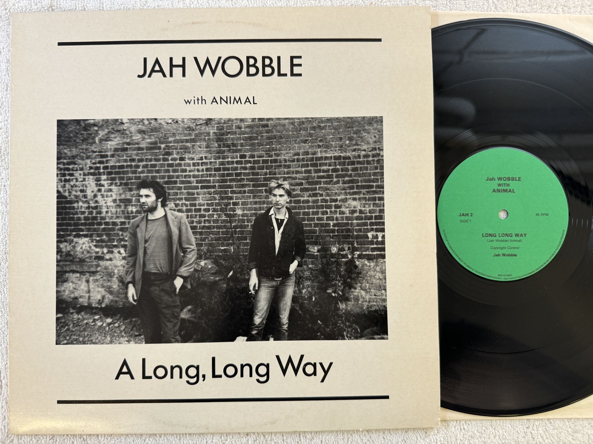 Omslagsbild för skivan Jah Wobble With Animal - A Long, Long Way 12" -82 UK LAGO JAH 2