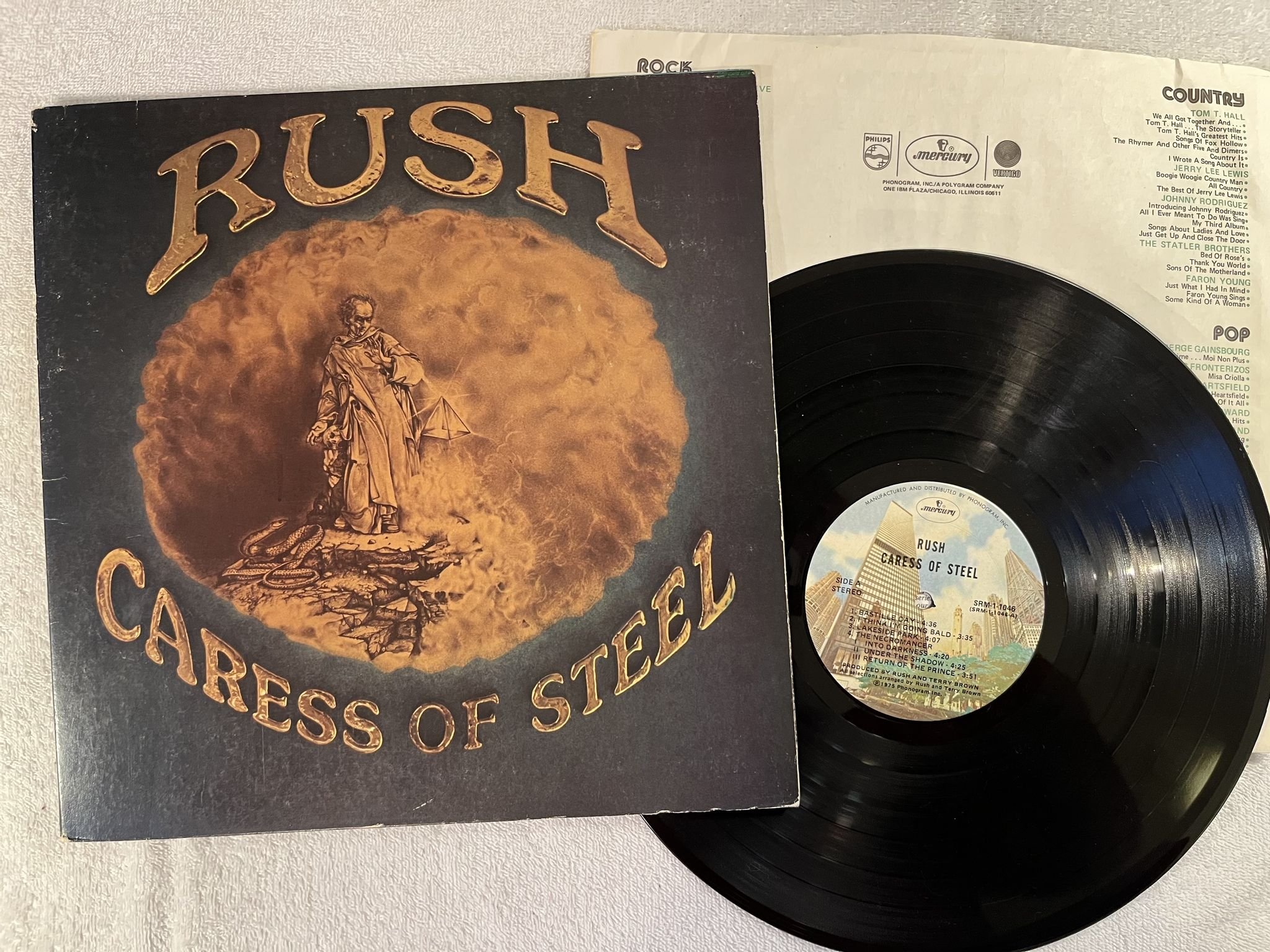 Omslagsbild för skivan RUSH caress of steel LP -75 US MERCURY SRM-1-1046