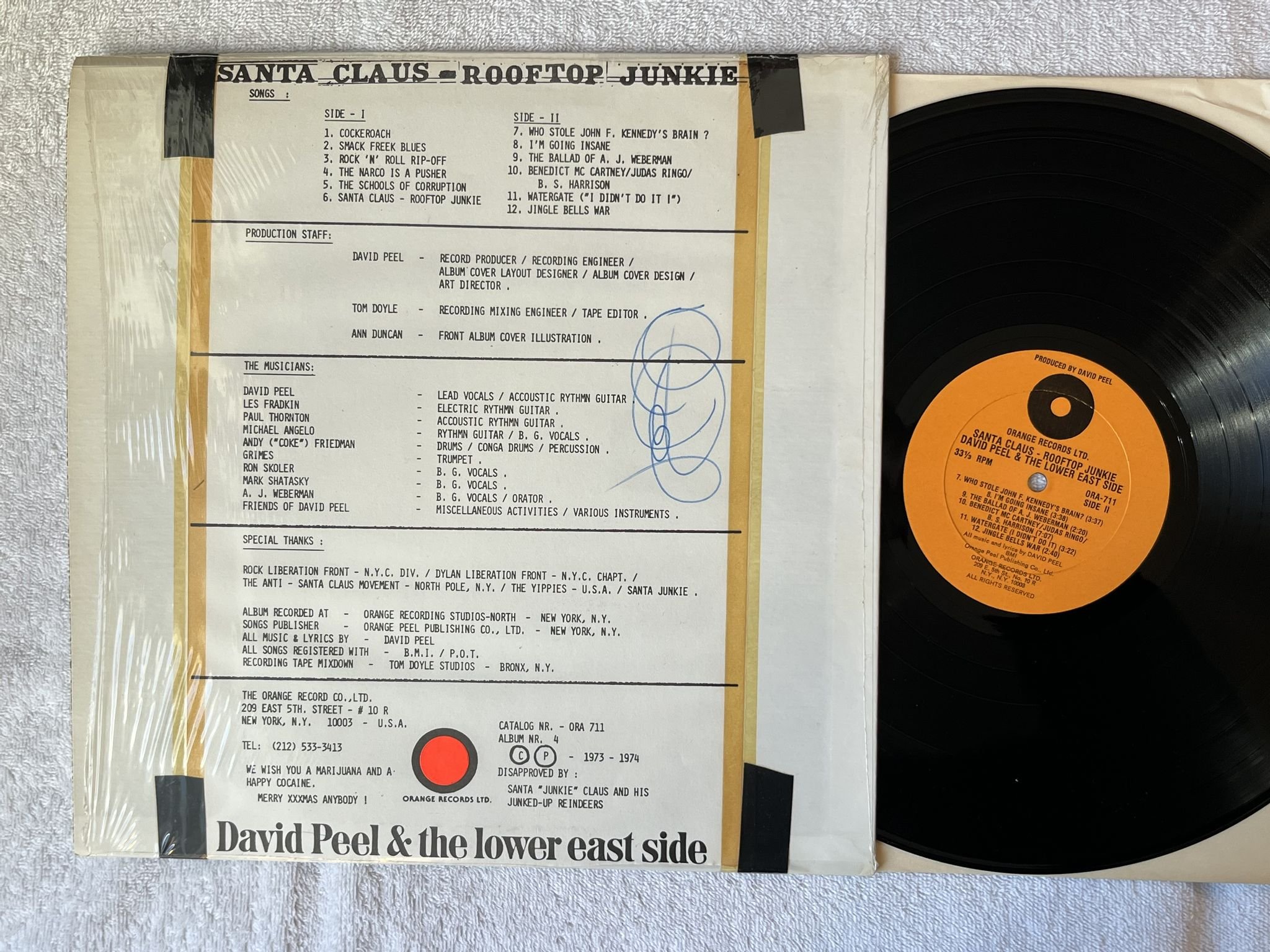 Omslagsbild för skivan DAVID PEEL Santa Claus - Rooftop Junkie LP -74 US ORANGE ORA 711