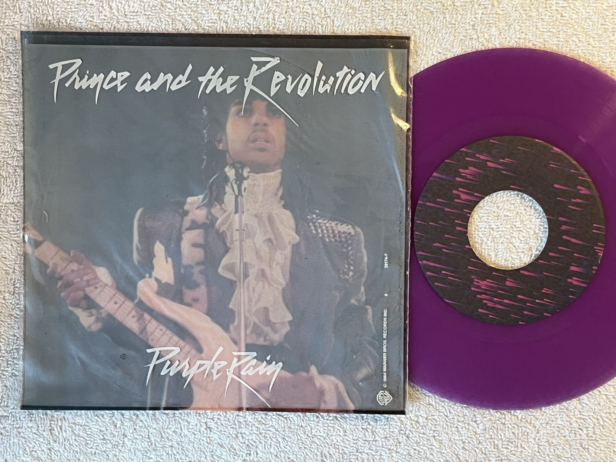 Omslagsbild för skivan PRINCE purple rain 7" -84 Ger WARNER 929174-7
