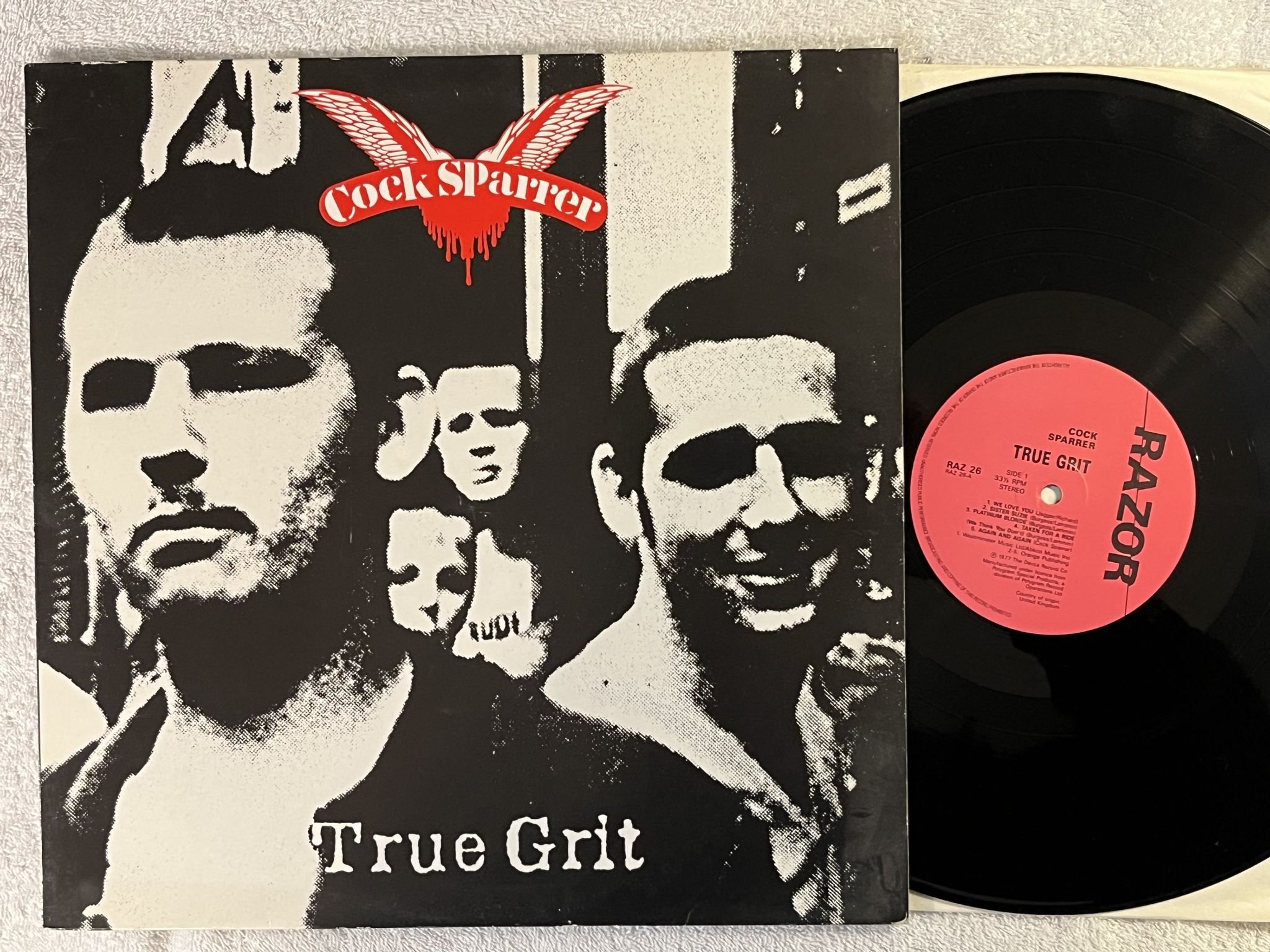 Omslagsbild för skivan COCK SPARRER true grit LP -87 UK RAZOR RAZ 26