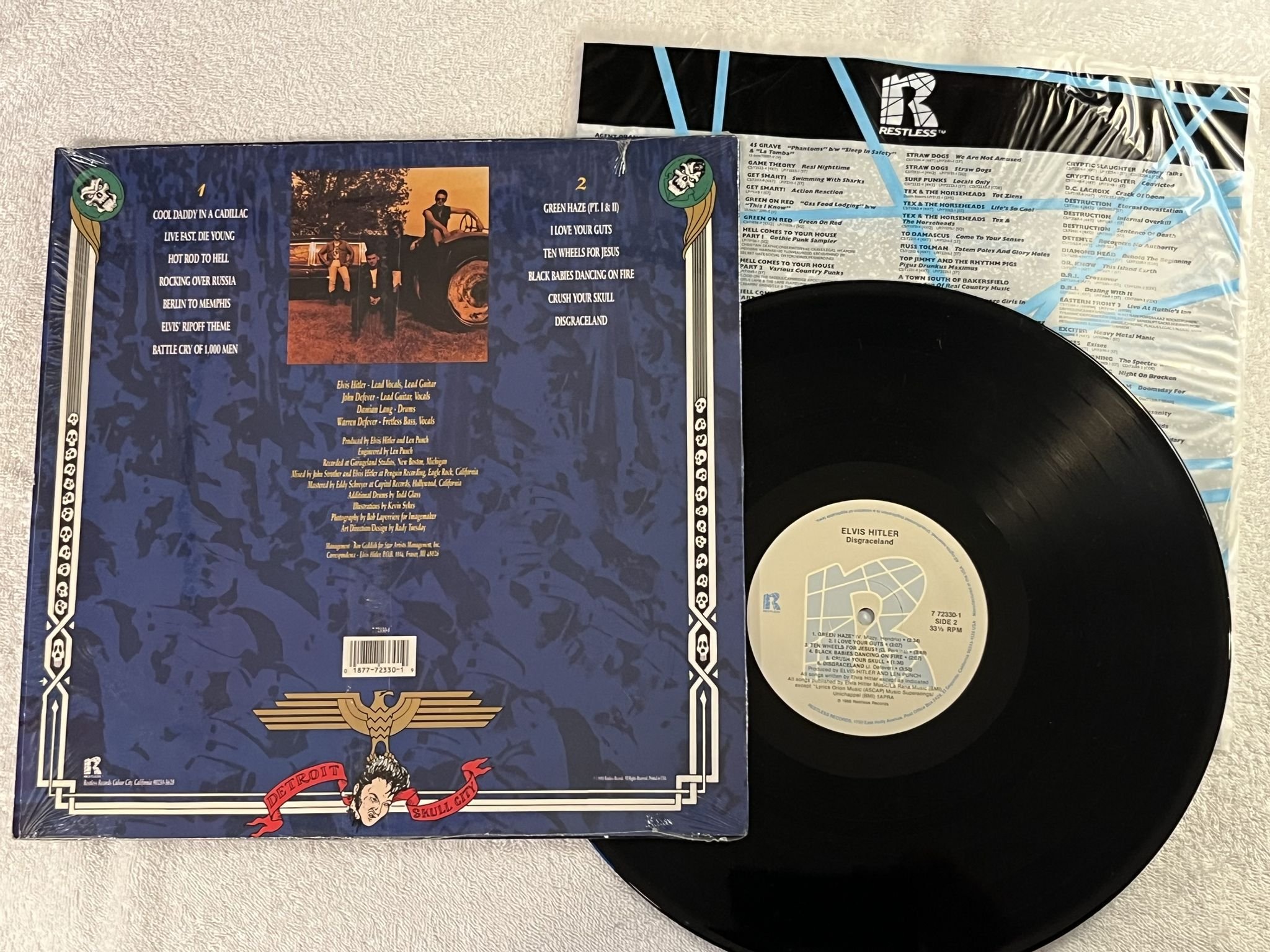 Omslagsbild för skivan ELVIS HITLER Disgraceland LP -88 US RESTLESS 772330-1 ** PSYCHOBILLY **