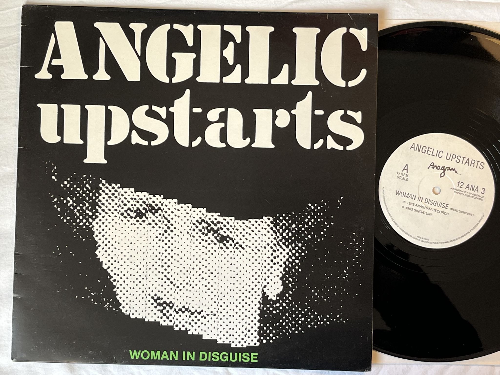 Omslagsbild för skivan ANGELIC UPSTARTS Woman In Disguise 12" -82 UK anagram 12 ANA 3