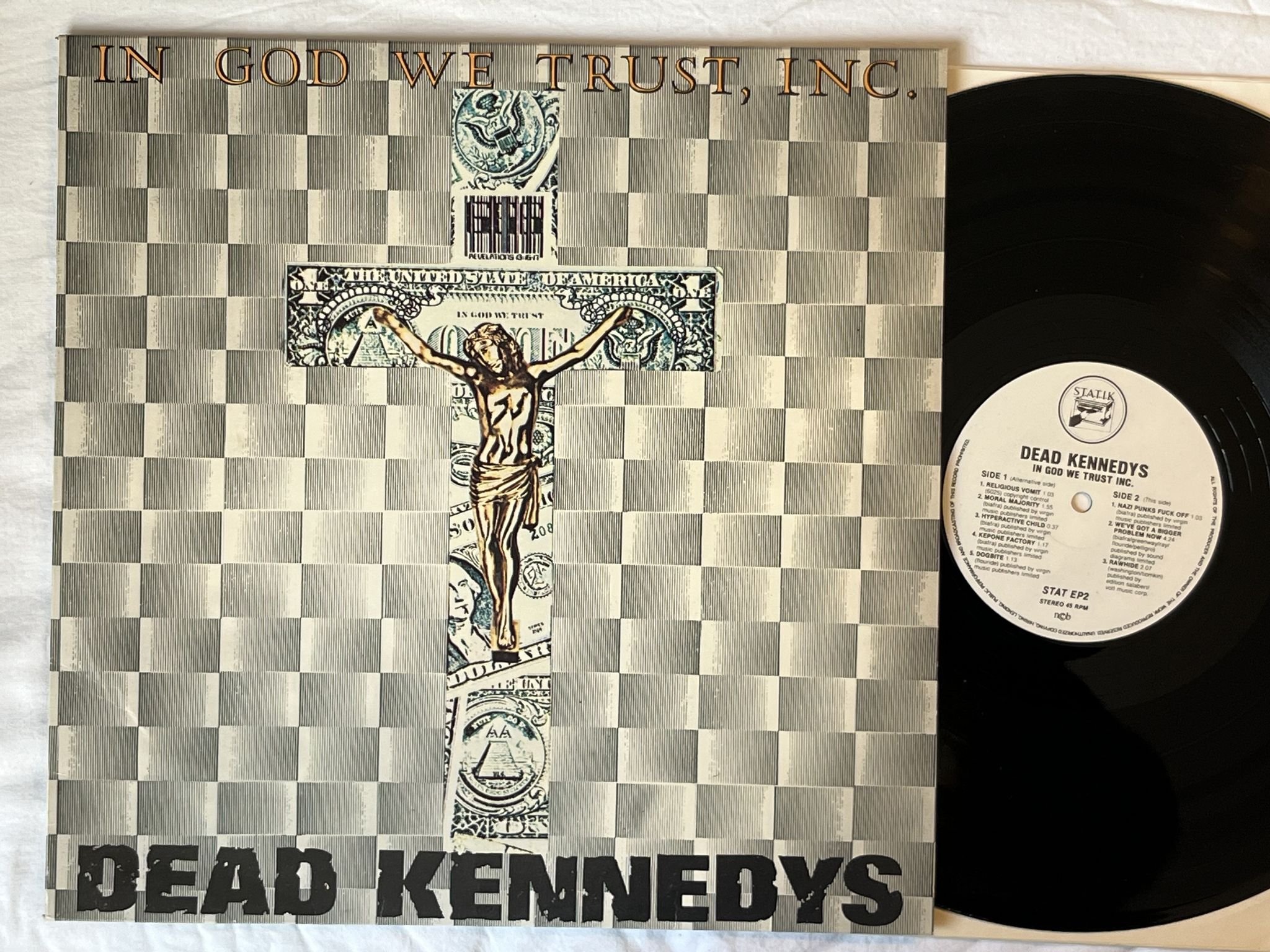 Omslagsbild för skivan DEAD KENNEDY'S in God we trust inc 12"ep -81 ncb STATIK STAT EP2
