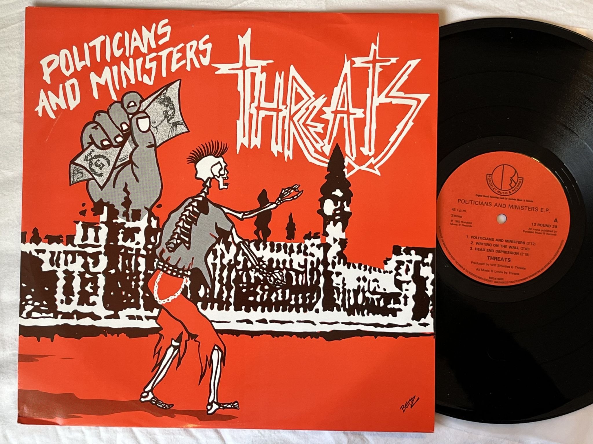 Omslagsbild för skivan THREATS politicians and ministers e.p. 12" -82 UK ROUNDELET 12 ROUND 29