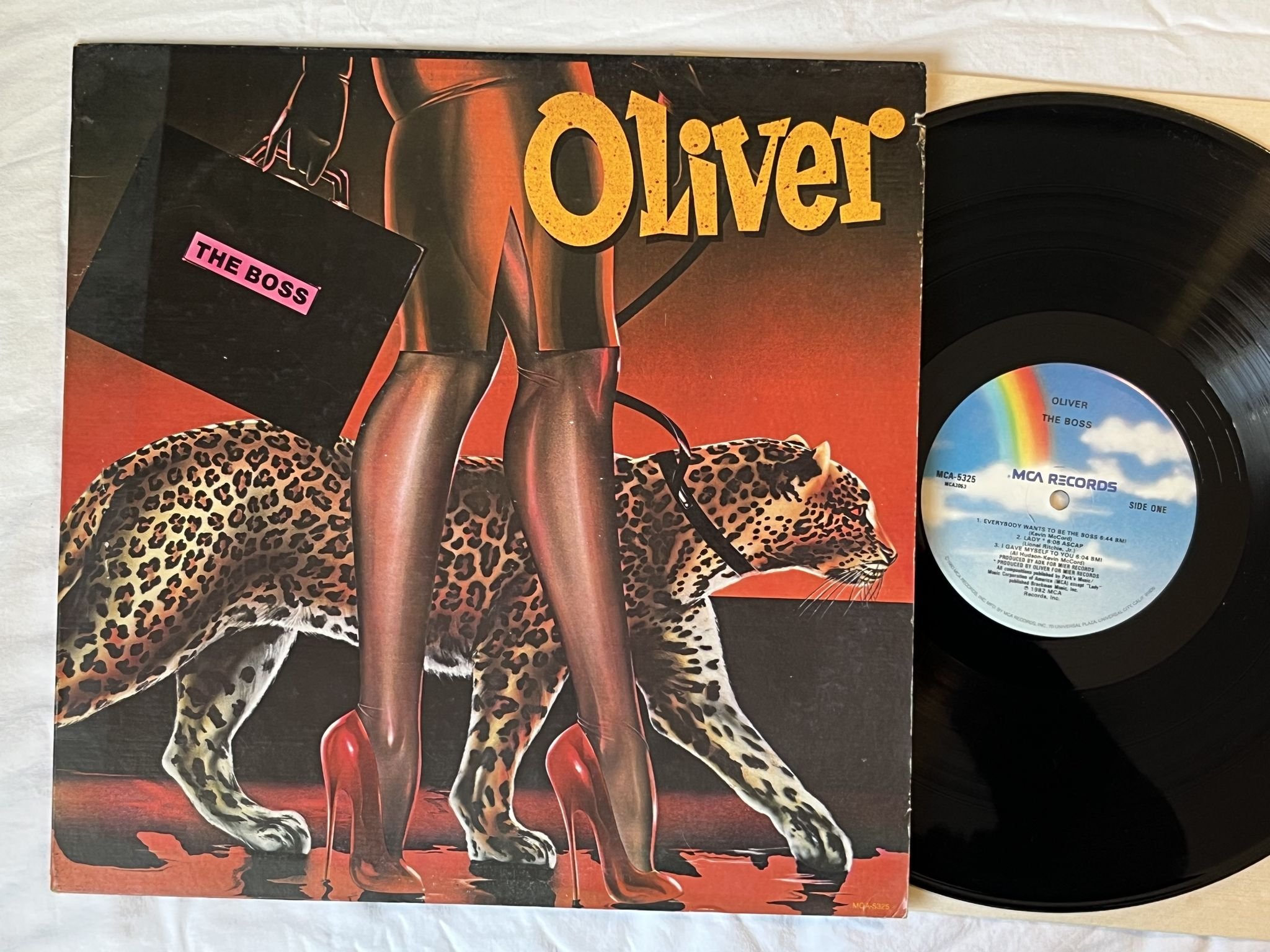 Omslagsbild för skivan OLIVER the boss LP -82 US MCA 5325 *** DISCO / FUNK ***